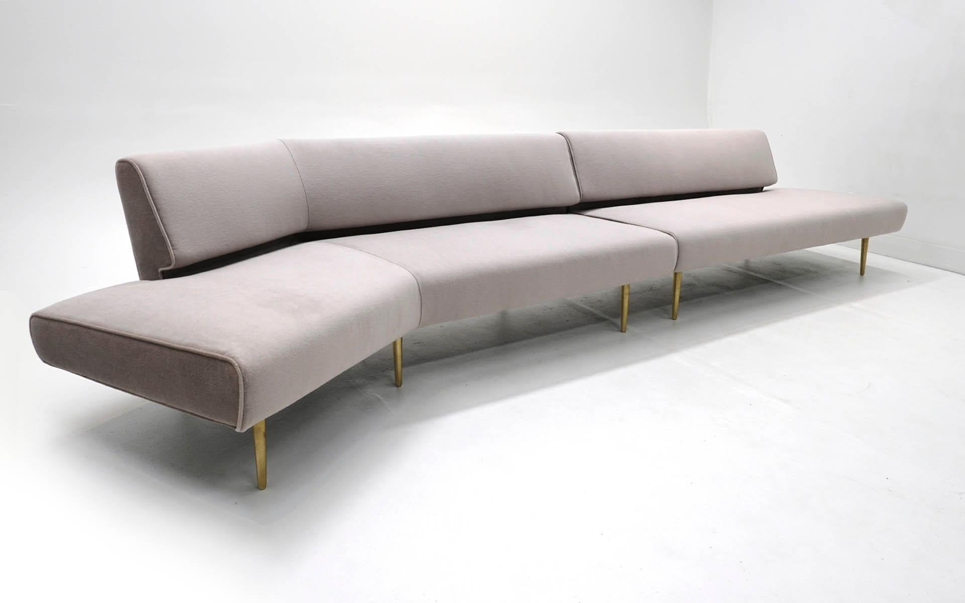 Two piece, armless, sectional sofa designed by Edward Wormley, made by Dunbar. A combination of models 4756 and 4828 in the Dunbar Catalog. The backless end on the angled piece (4756) curves towards the front at a 30 degree angle. The straight piece