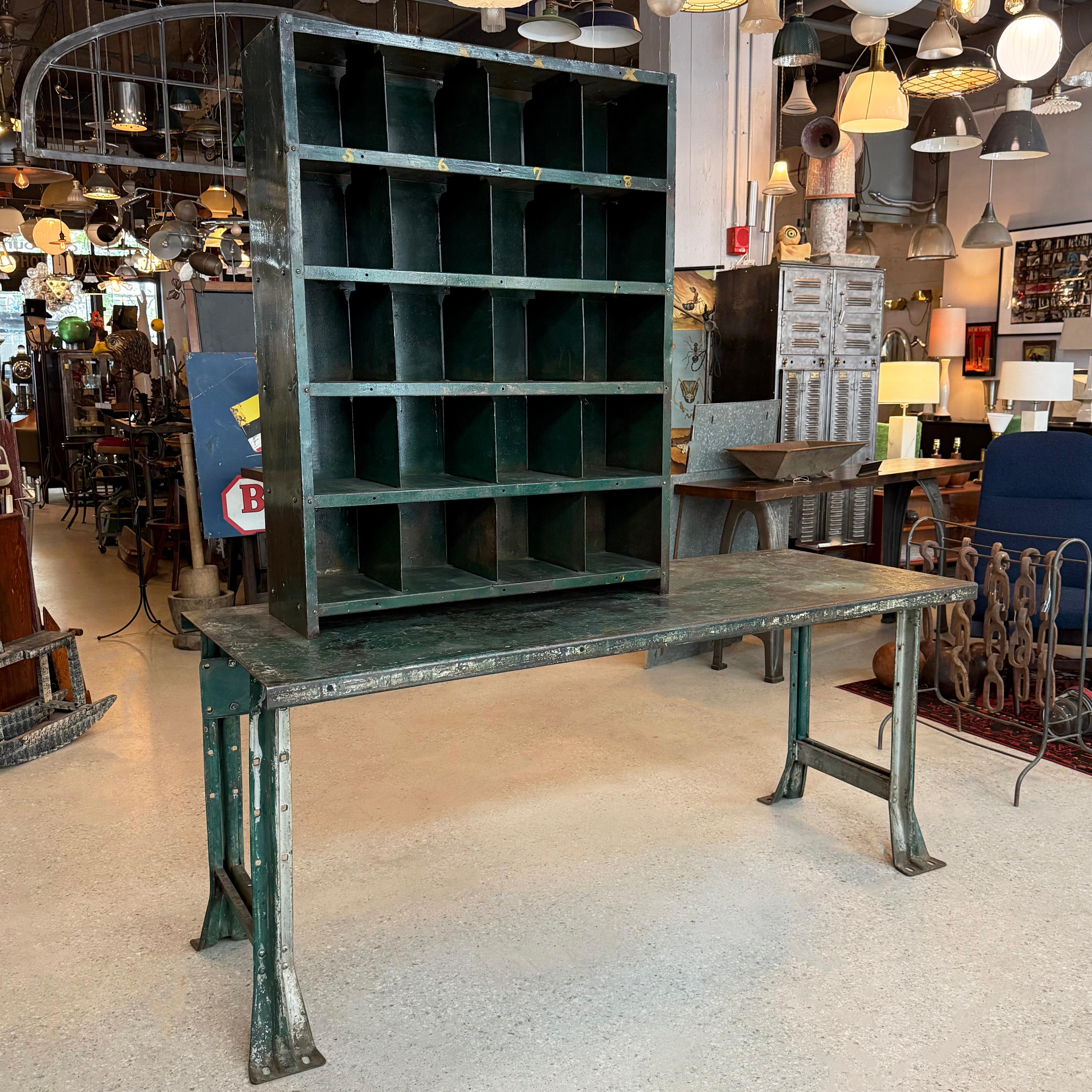 This American industrial workbench table with tool storage is comprised of two pieces made of pressed and folded heavy duty steel with all original work-worn patina. The set was fabricated by the Lyon Metallic Manufacturing. Co., in Aurora Illinois