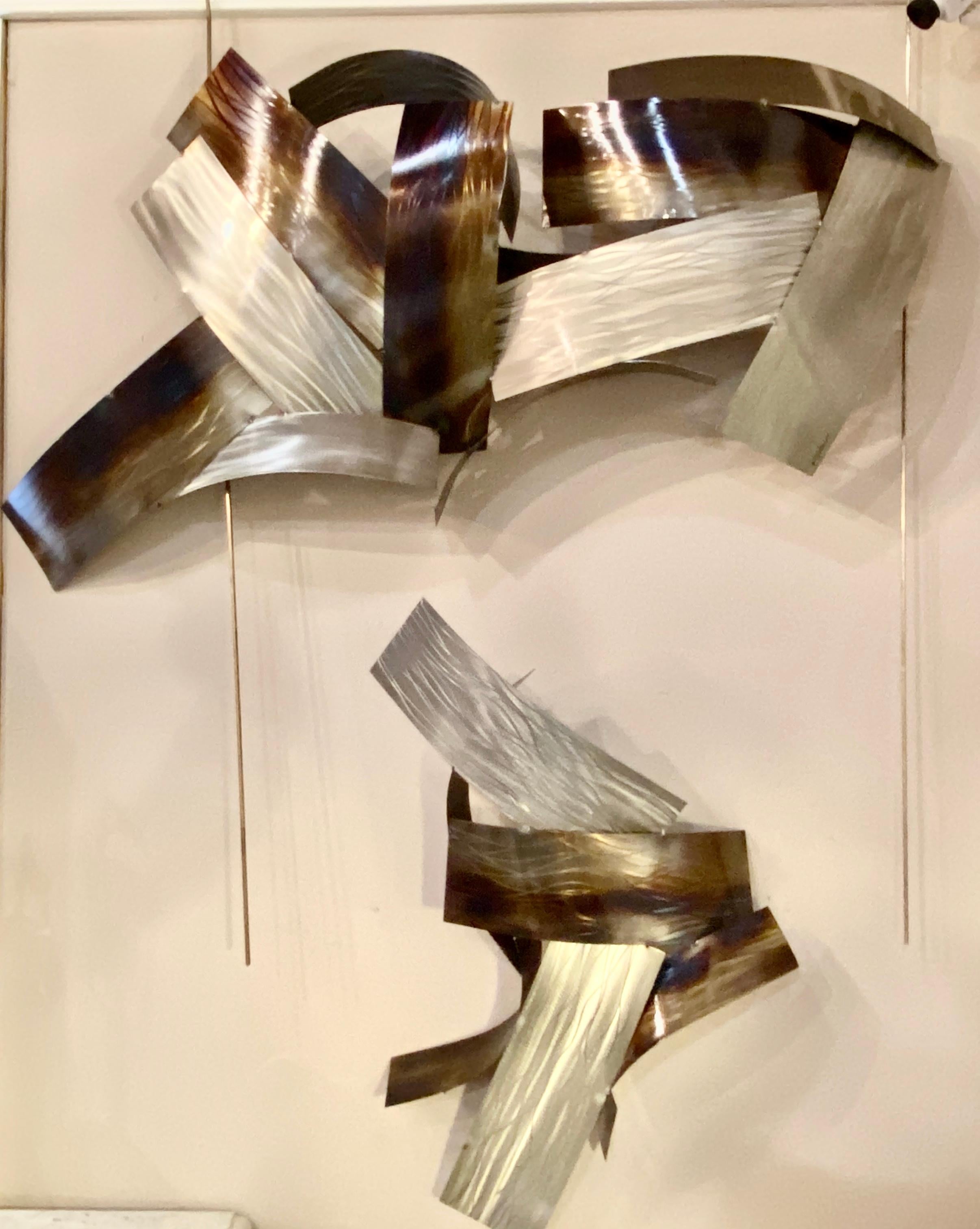 Two piece modern metal wall sculpture by Johnston 2011
The large piece measures 44 inches width, 22 high, 7 depth. The smaller measures 30 inches height, 19.5 width, 7 depth.