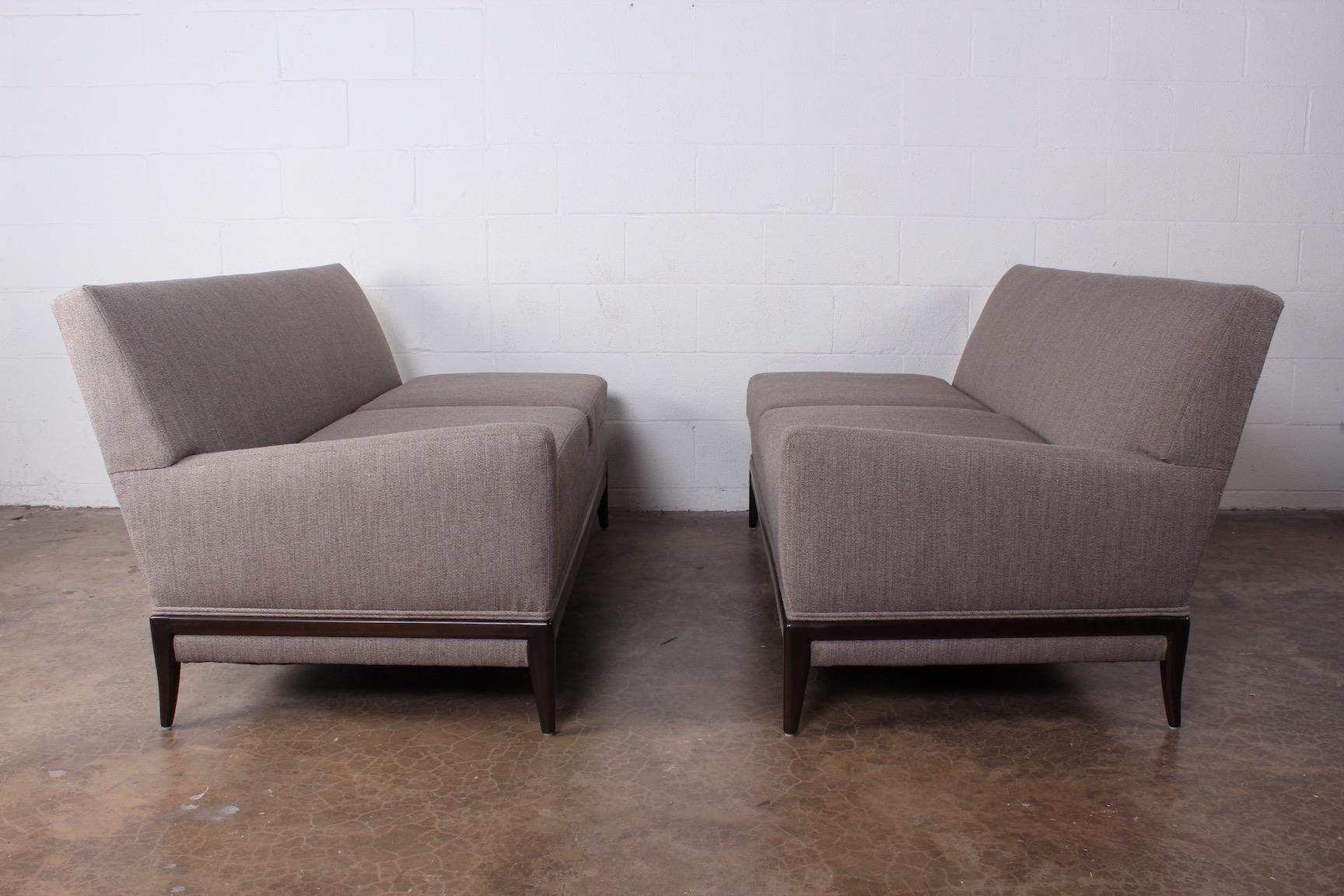 A two piece sofa designed by Tommi Parzinger for Parzinger originals.
Measures: 60 x 32 x 29.75 H each.