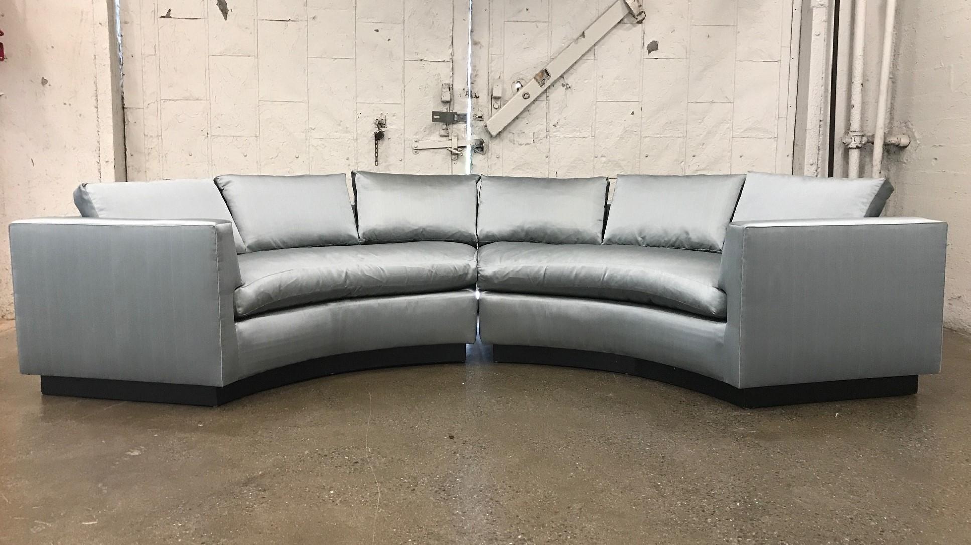 Two-piece sofa sectional in satin with a black lacquered wooden base. The loose cushions are down. Milo Baughman style.
Each sectional measures: Mid Century Modern.
Measures: 87 W x 41 D x 34.5 H (height is to the top of back cushions).
 