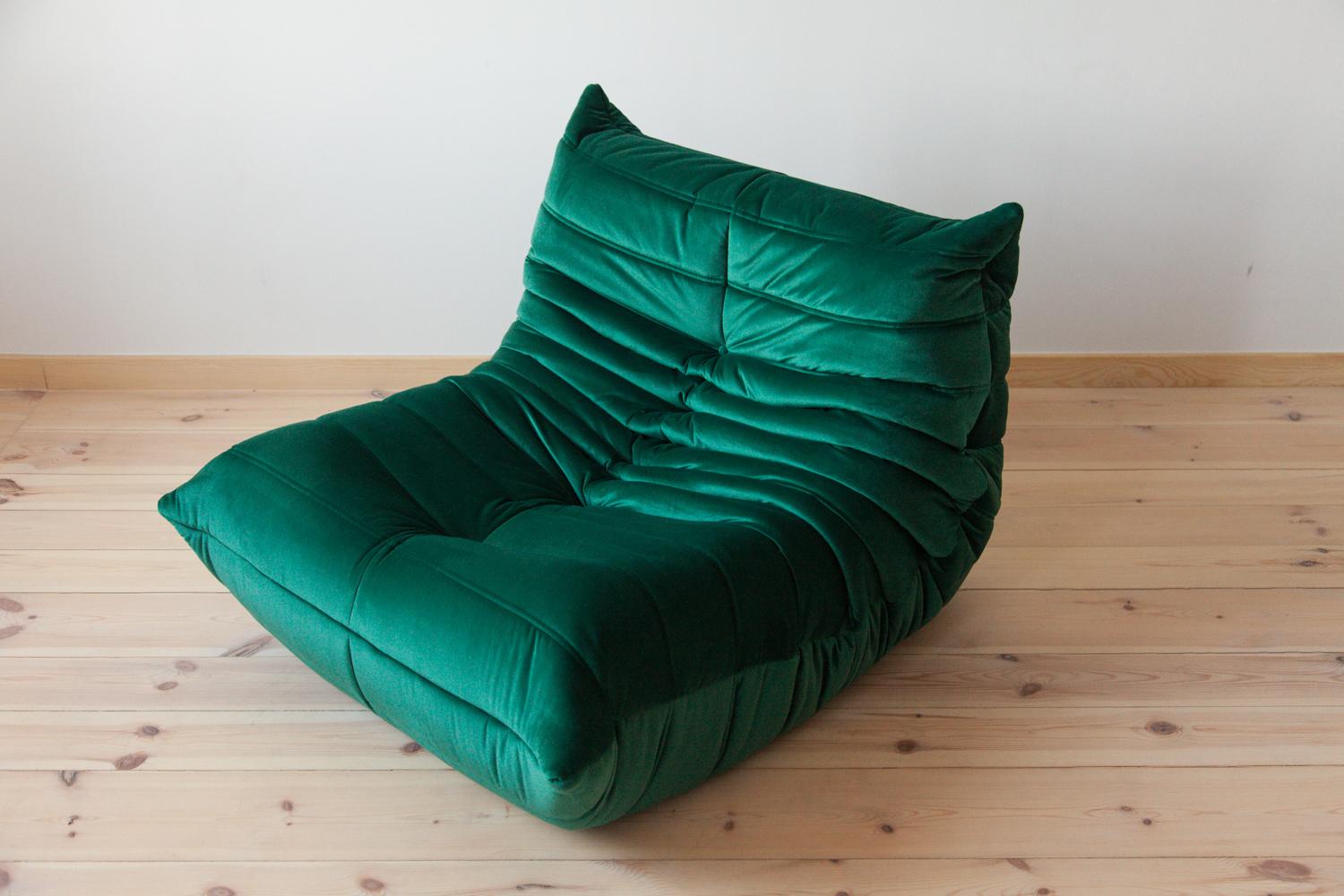 This Togo living room set was designed by Michel Ducaroy in 1973 and manufactured by Ligne Roset in France. It has been reupholstered in bottle green high quality velvet, and is made up of the following pieces, each with the original Ligne Roset