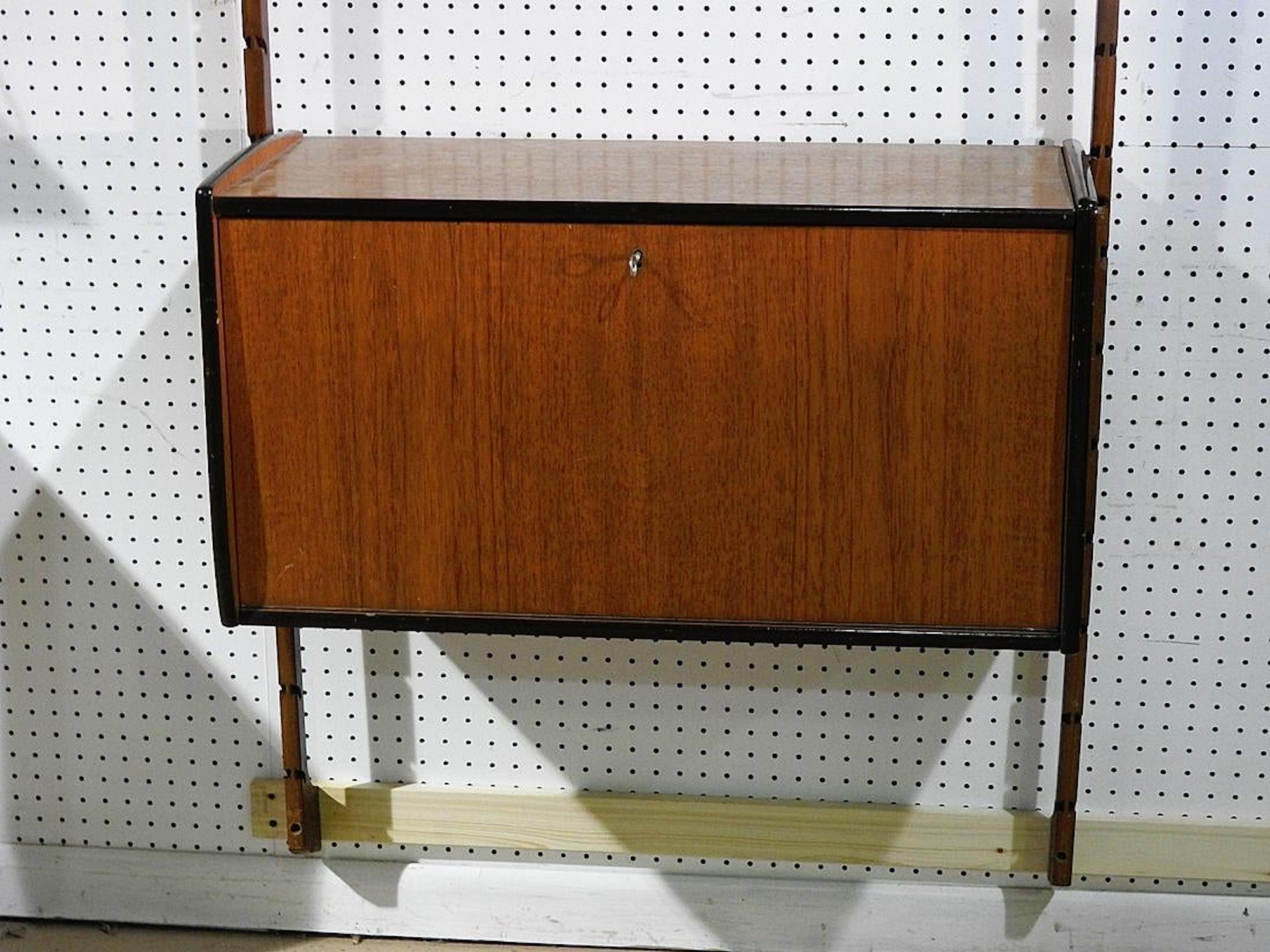 Wall hanging bar and cabinet. Mid-Century Modern in teak wood.
(Please confirm item location - NY or NJ - with dealer).
  