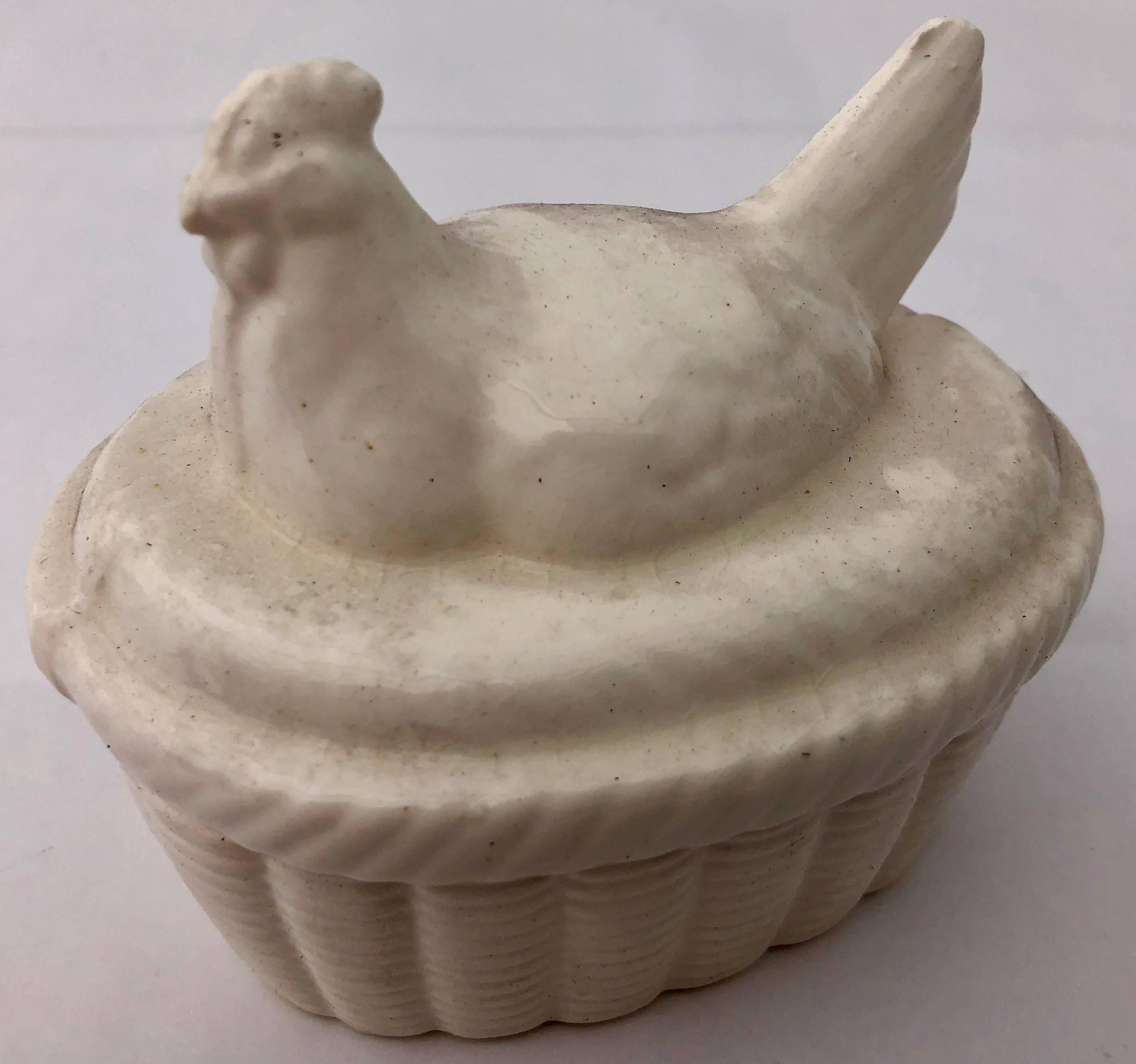 This is a handcrafted ceramic two-piece white chicken box was made in Japan in the 1980s. It was purchased for a French restaurant, but never used. It is oven safe, but could be used for any number of uses in and out of the kitchen. It comes in it's