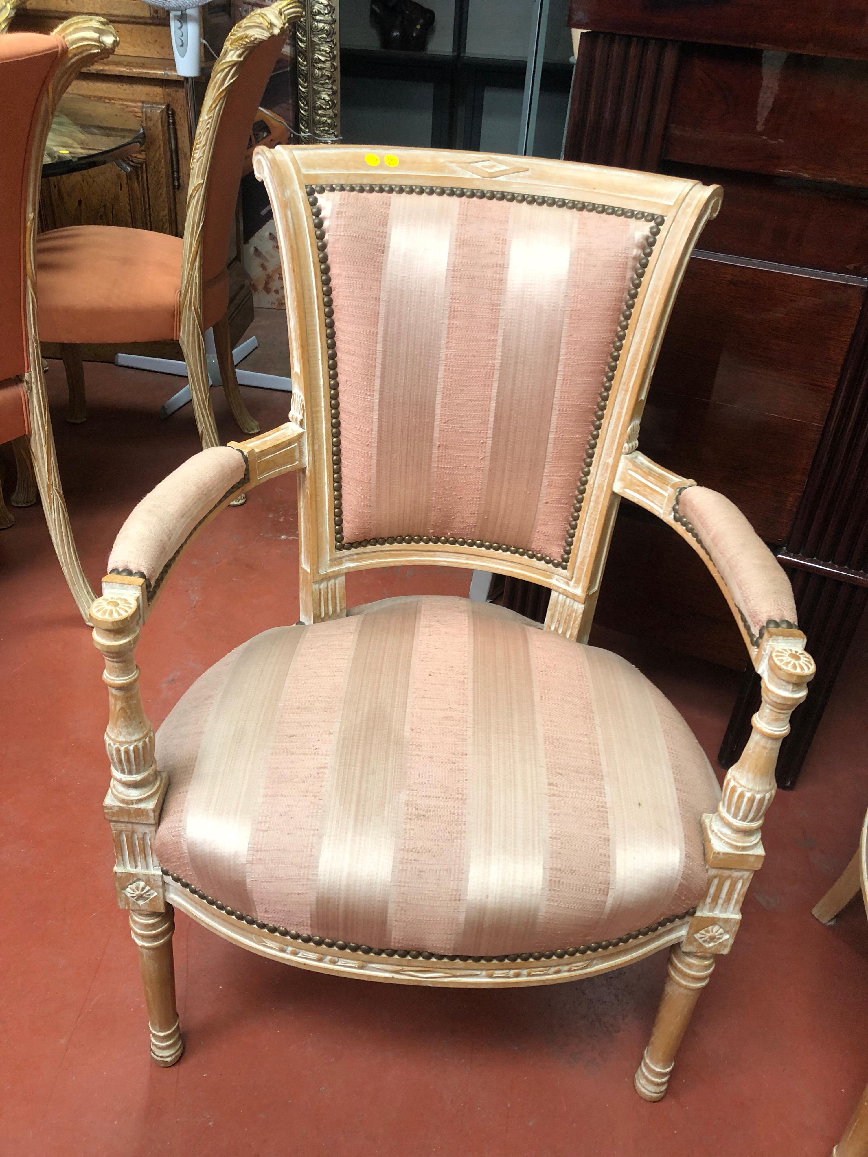 A pair of pink reupholstered 19th century beautiful French armchairs.