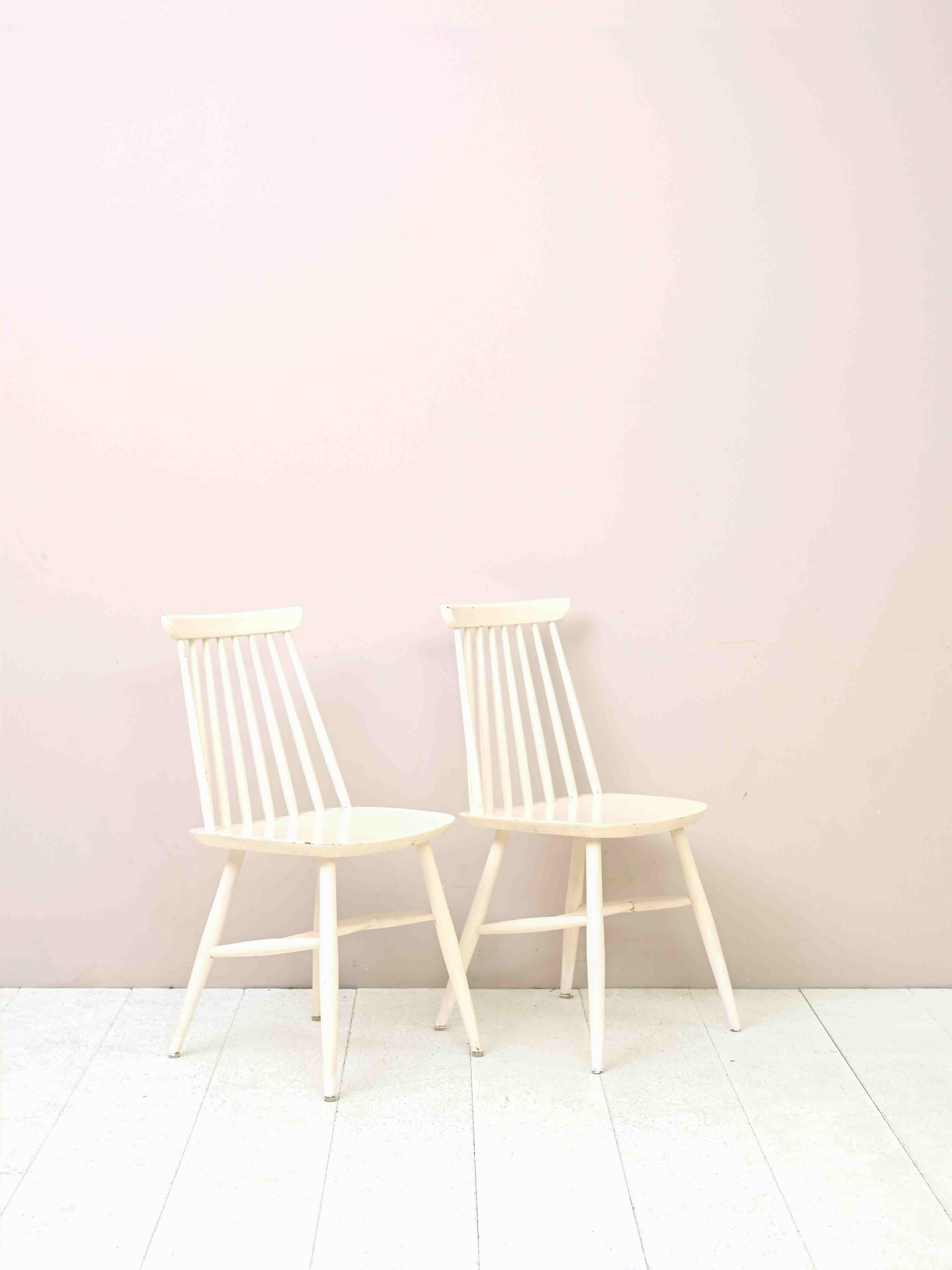 Scandinavian Modern Two 'Pinstolar' Chairs Made of Wood Painted White For Sale