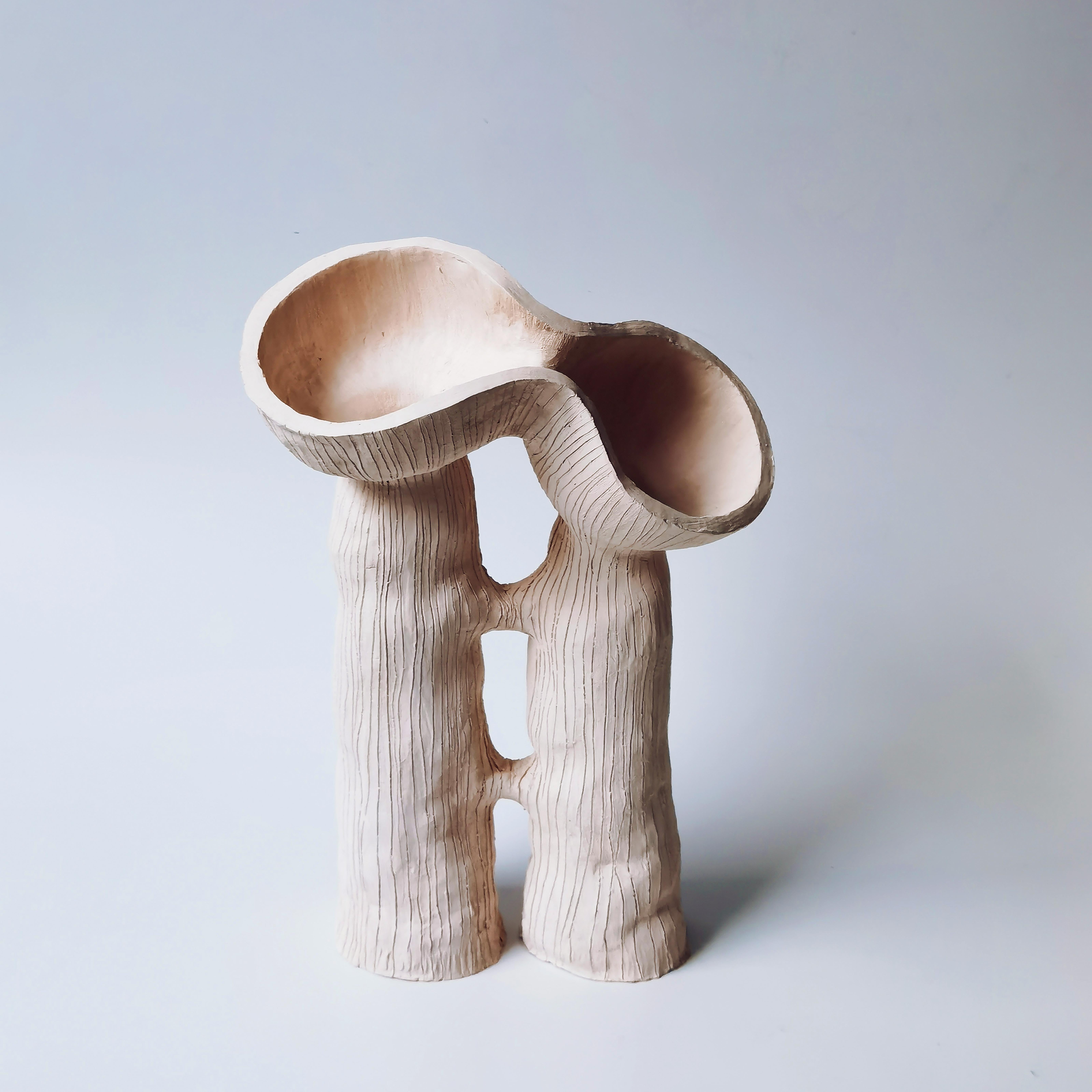 Two Pod, Two Stem by Jan Ernst
Dimensions: H 35 cm
Materials: White Stoneware

Jan Ernst’s work takes on an experimental approach, as he prefers making bespoke pieces by hand. His organic design stems from his
abstract understanding of form and
