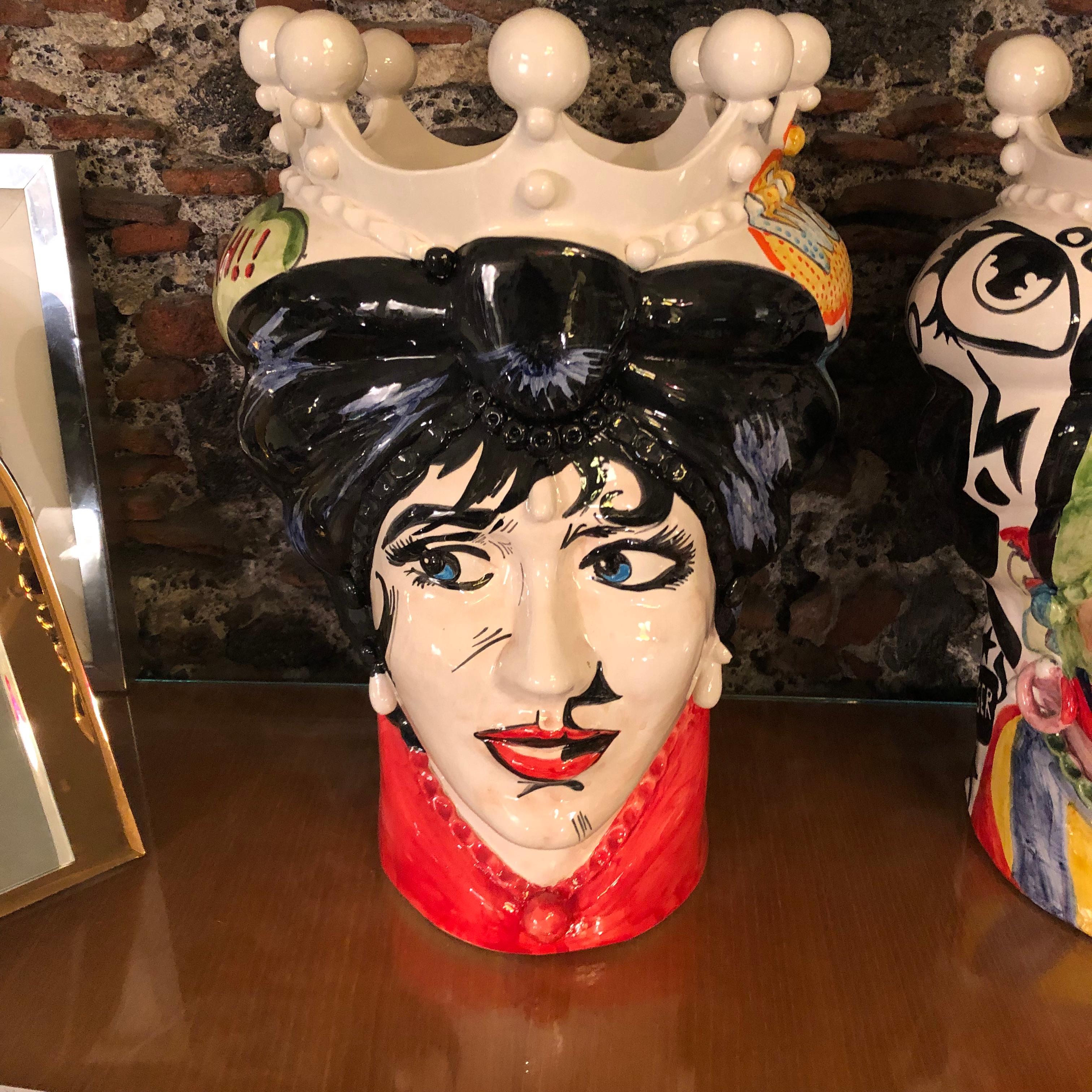 It's an amazing pair of white clay Sicilian Moro's head vases, interpreted in a Pop Art style by a Sicilian painter and signed 1/1 MR on the base. There are no copies of these, they are uniques pieces. The legend of the Sicilian Moro's heads speaks