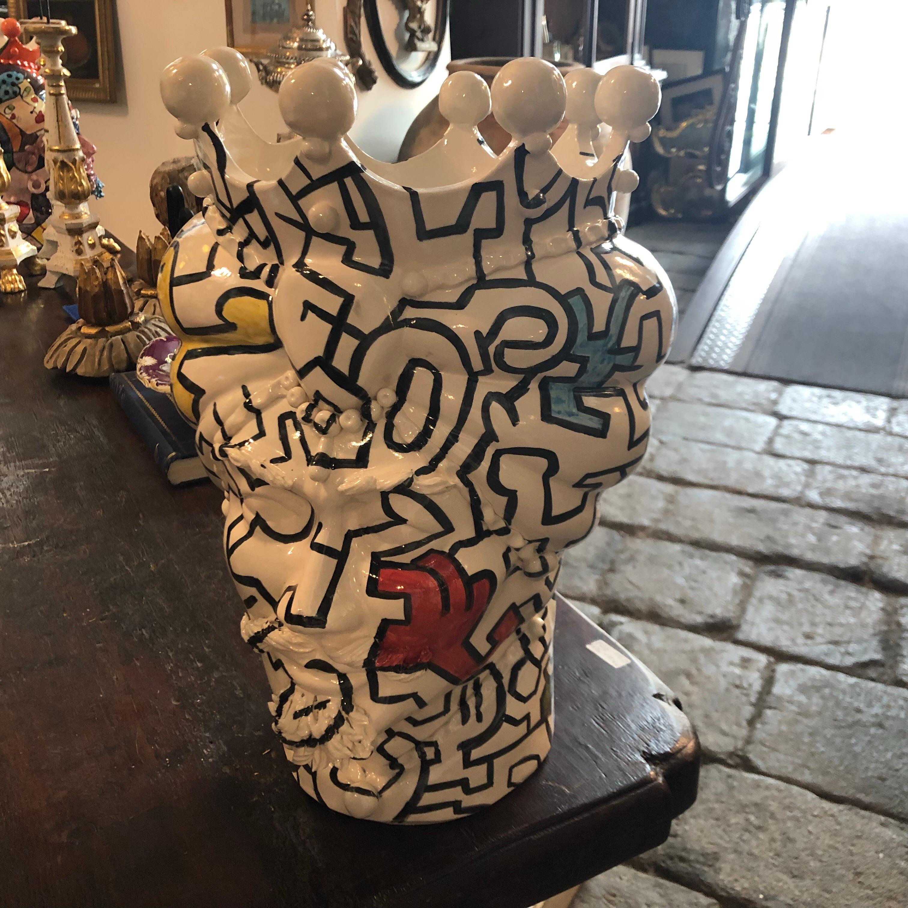 It's an amazing pair of white clay Sicilian Moro's head vases, interpreted in a Pop Art style by a Sicilian painter and signed 1/1 MR on the base. There are no copies of these, they are uniques pieces. The legend of the Sicilian Moro's heads speaks