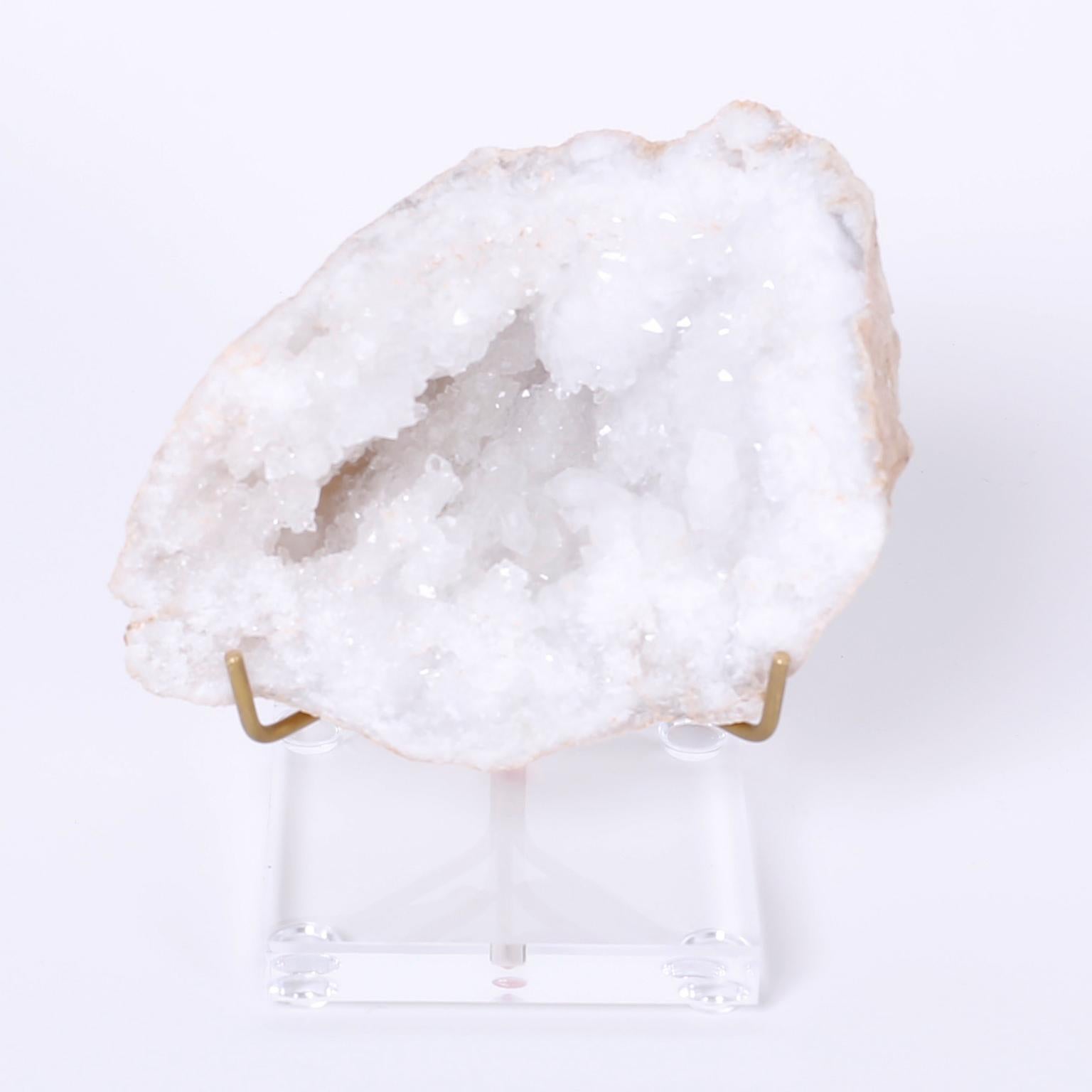 Quartz geode split into two specimens presented on lucite and brass
stands to enhance the alluring geological spectacle. Priced Individually.

Left:   H: 5 W: 5 D: 4  $375.00
Right: H: 7 W: 6 D: 6  $450.00