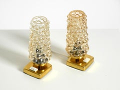 Two rare 1960s brass bedside lamps with gold bubble glass shades