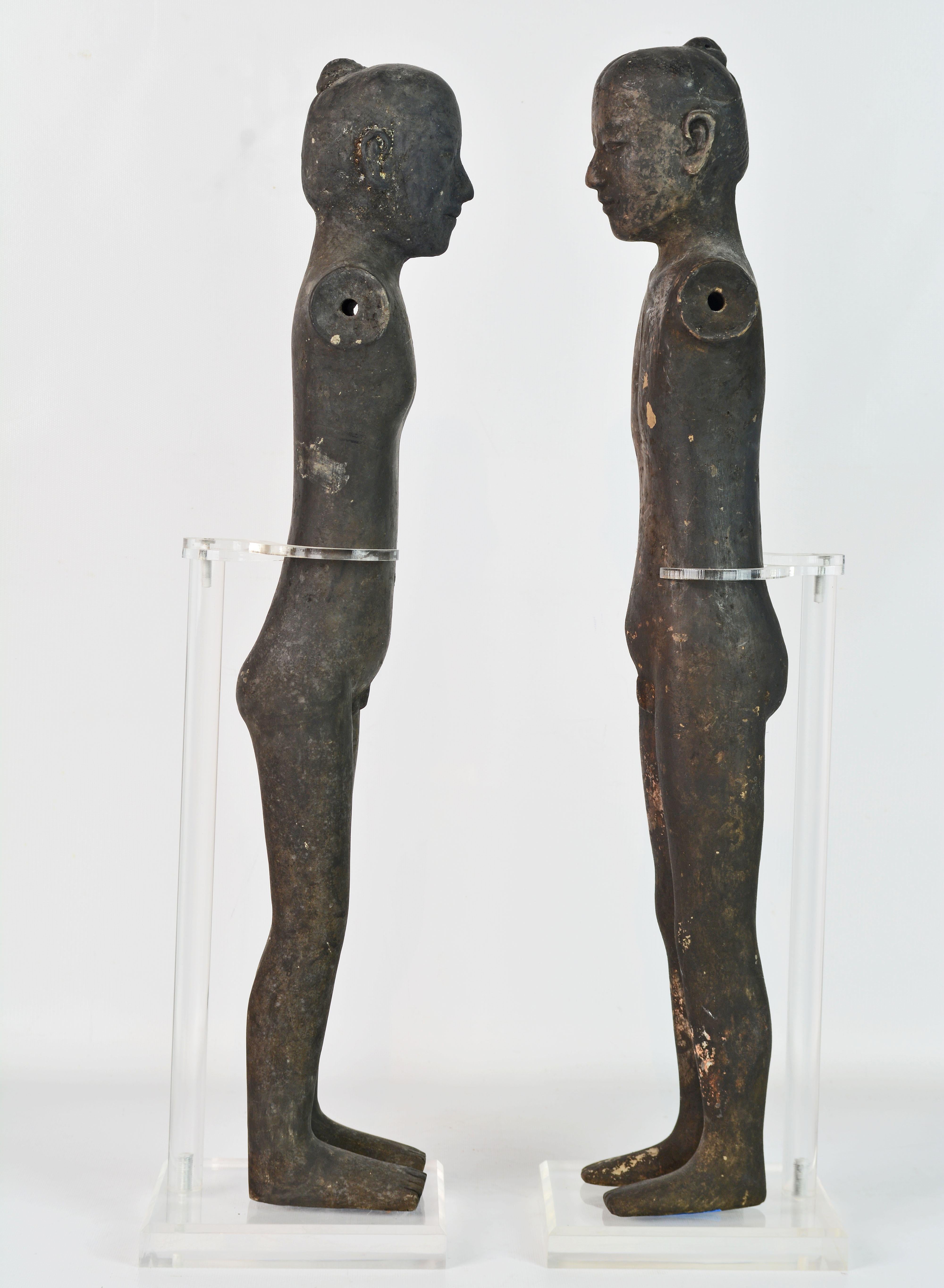 Two Chinese style of Han Dynasty models of tall slender men called stick figures because of their elongated shape.
These naked figures would originally have had clothing and wooden arms, which have long since perished. Their faces are expressive,