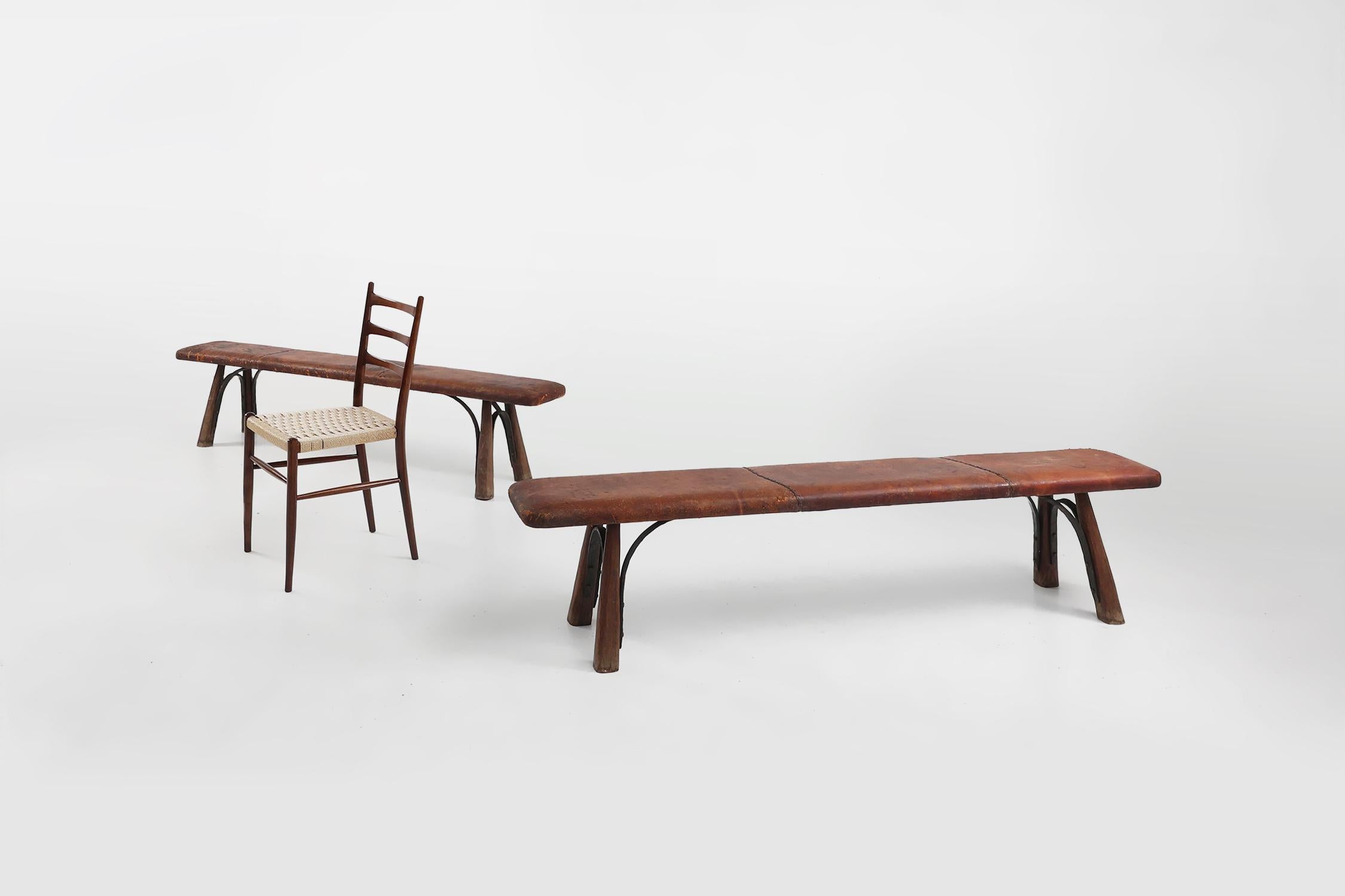 France / 1920 / 2 gym benches / oak, leather, wrought iron / Industrial / Antique / Rustic

Two very rare antique industrial gym benches hand crafted around 1920 in France. 

The benches have beautiful cognac colored leather on top and rest on four