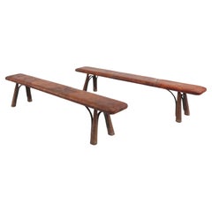 Two rare industrial gym benches in oak and wrought iron with leather top