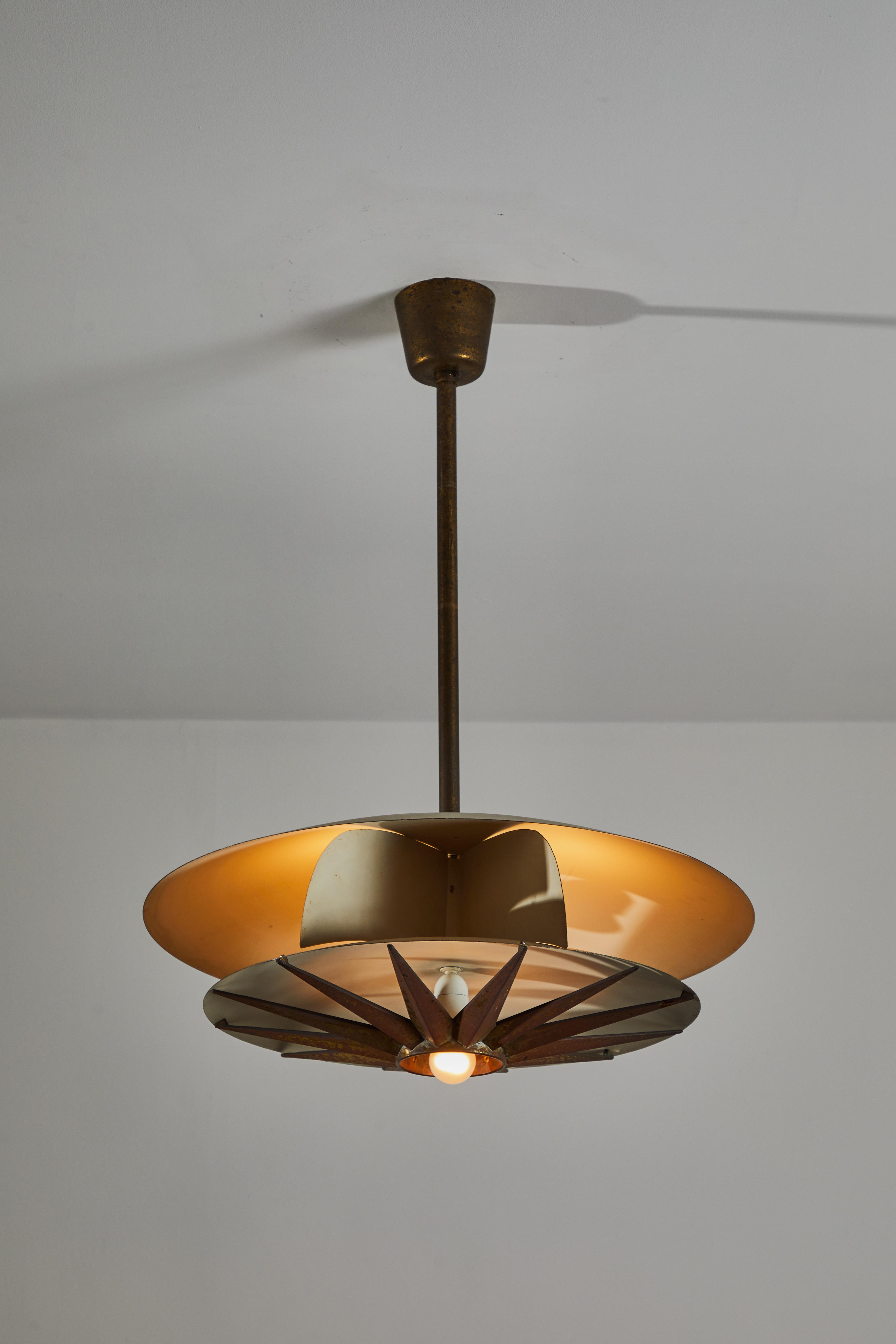 Single rare pendant by Tomaso Buzzi. Designed and manufactured in Italy, circa 1950s. Enameled metal, brass. Rewired for U.S. standards. Original canopy. We recommend four E27 65w maximum bulbs. Priced and sold as single lights. Only one light