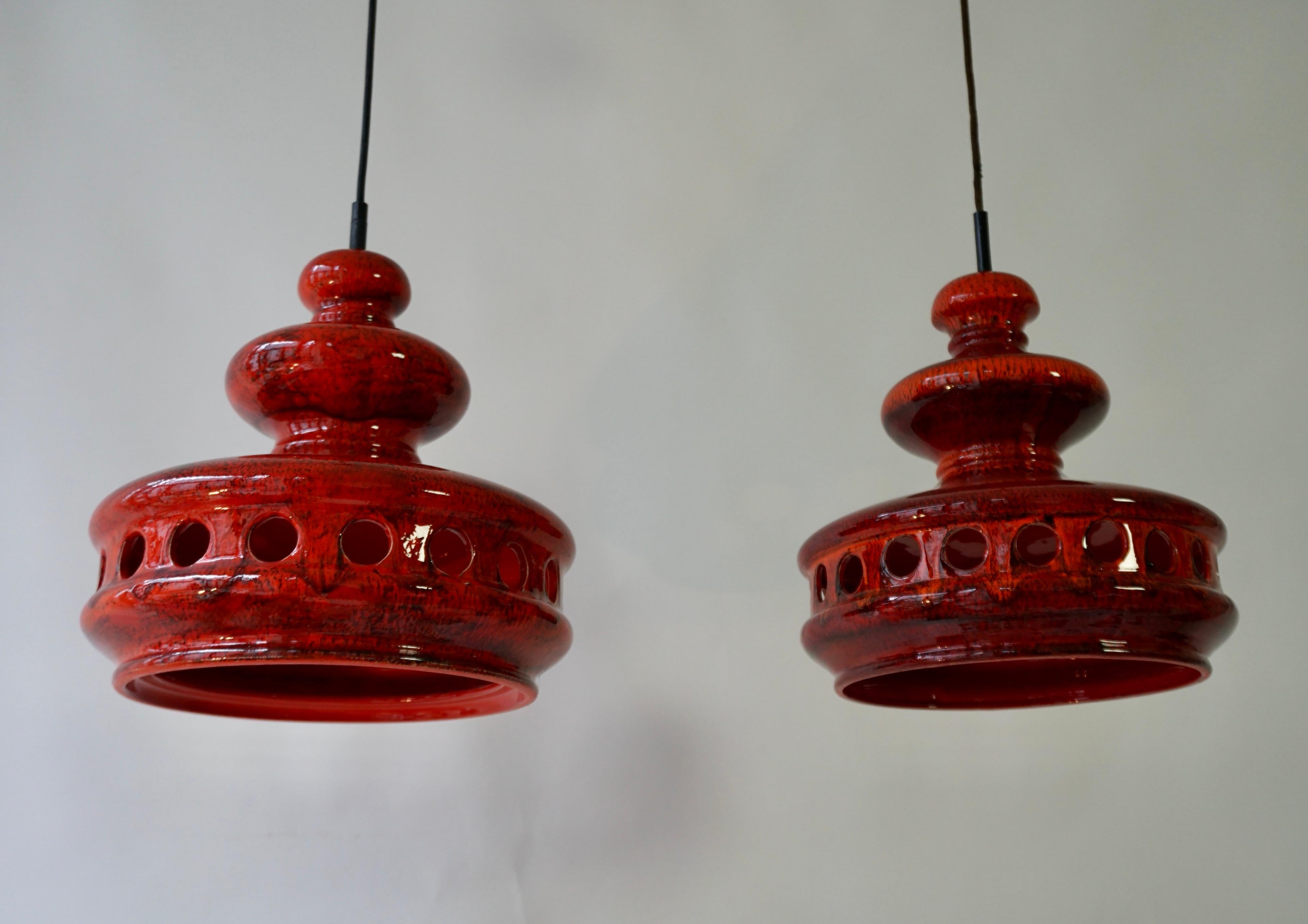 Two red ceramic fat lave ceiling lights.

Total height 37