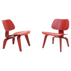 Two Red Stained Ash Plywood Group LCW Chairs by Charles & Ray Eames for Vitra