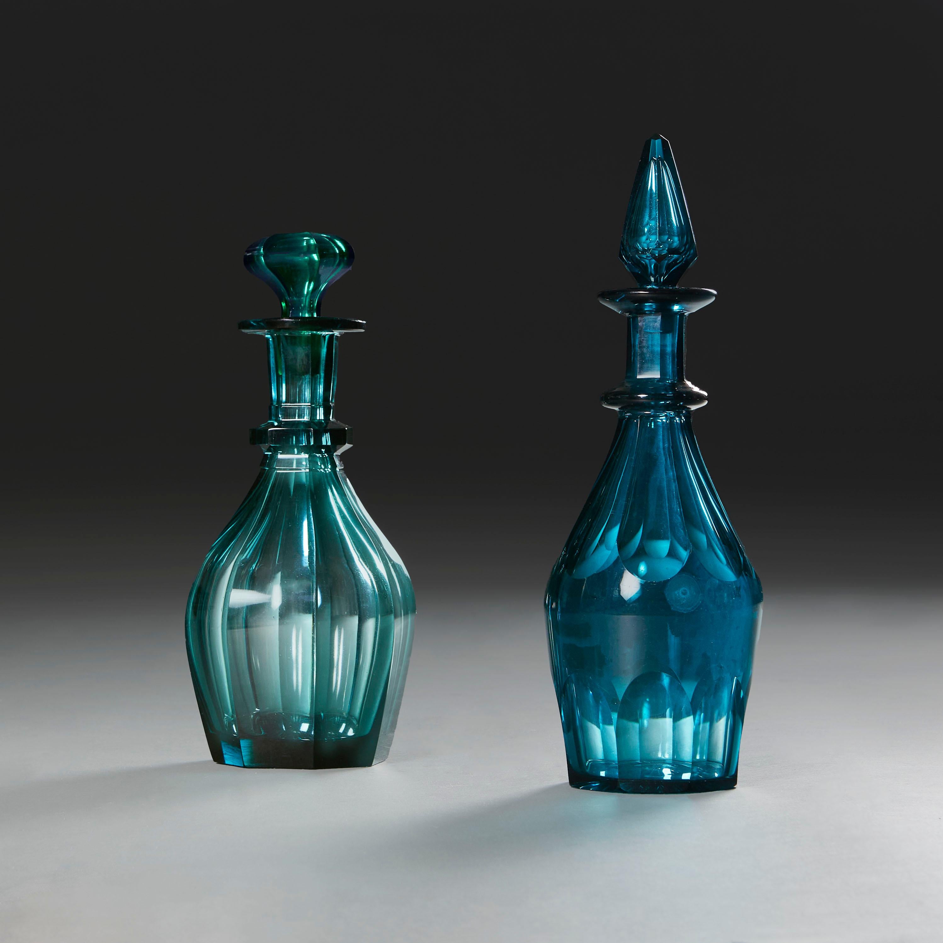 England, circa 1820

Two Regency cut glass spirit decanters, one blue, one turquoise, with faceted sides and stoppers.

£850 GBP each, or £1,700 GBP for the pair.

Height of taller           33.00cm
Height of smaller      29.00cm