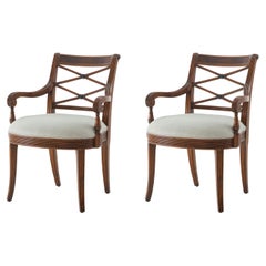 Deux fauteuils en acajou de style Régence