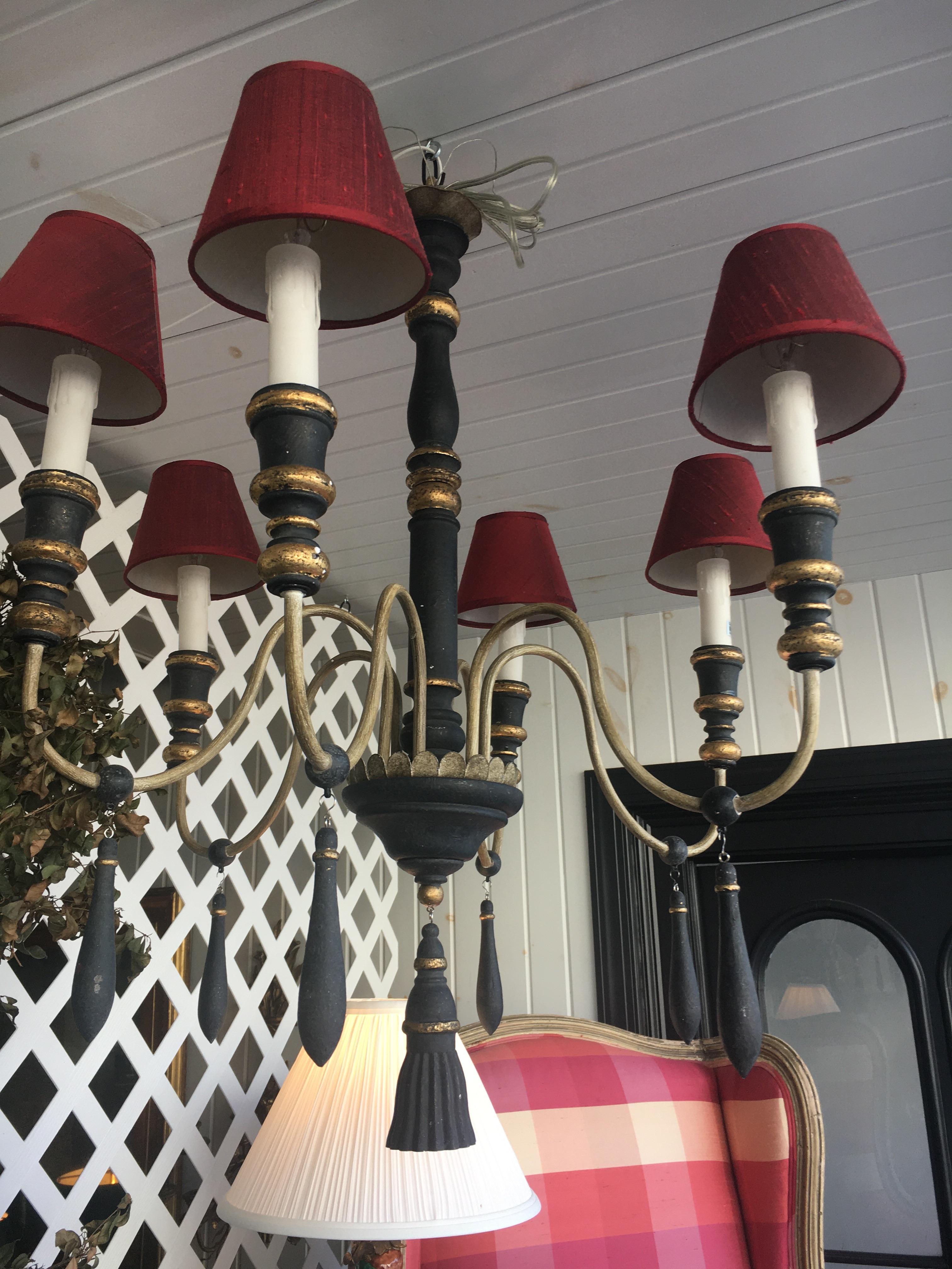 One pair of Regency style six-arm chandeliers with ebonized finish, gilt highlights.  Newly wired so ready for installation, includes chain and canopy assembly.  Priced per chandelier.  Feel free to call should you have further questions.