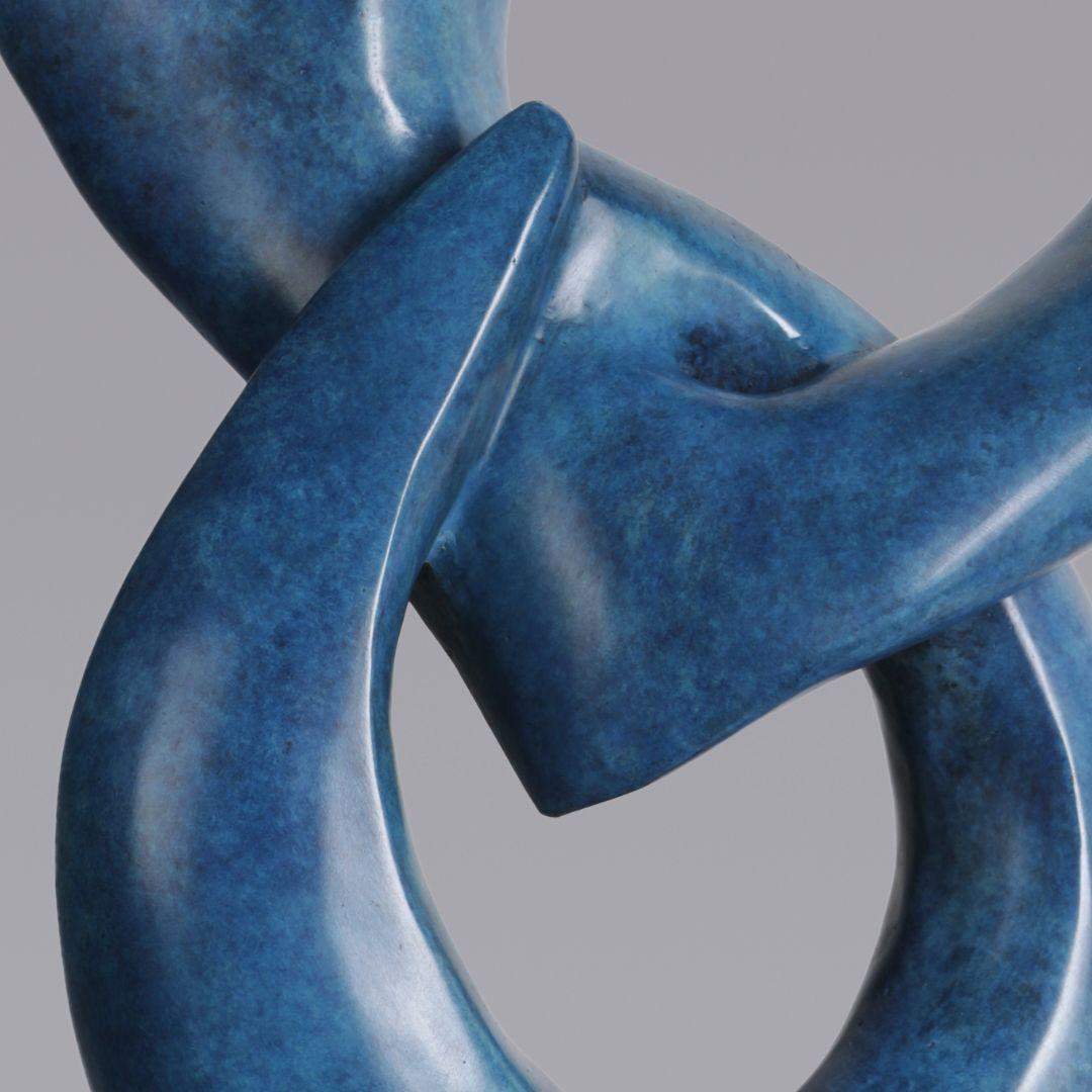 Embracing Work of Art entirely hand-crafted in Italy of organic modern shape, realized in bronze, finished with hand-made patina in lapis lazuli turquoise blue color. Raised on black granite base. Signed Fp Art with authenticity certificate. 