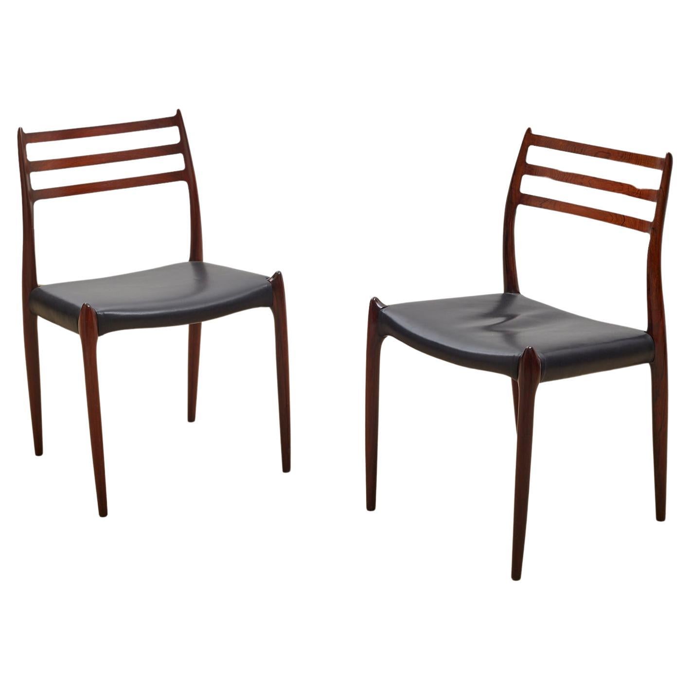 Two Rosewood, Black Leather Niels Otto Møller Chairs, Model 78. c1960