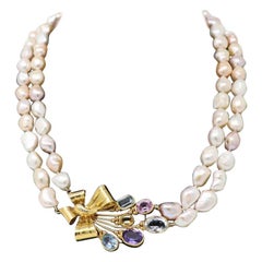 Two Rounds of Pearls Pendant in Gold and Natural Stones Necklaces