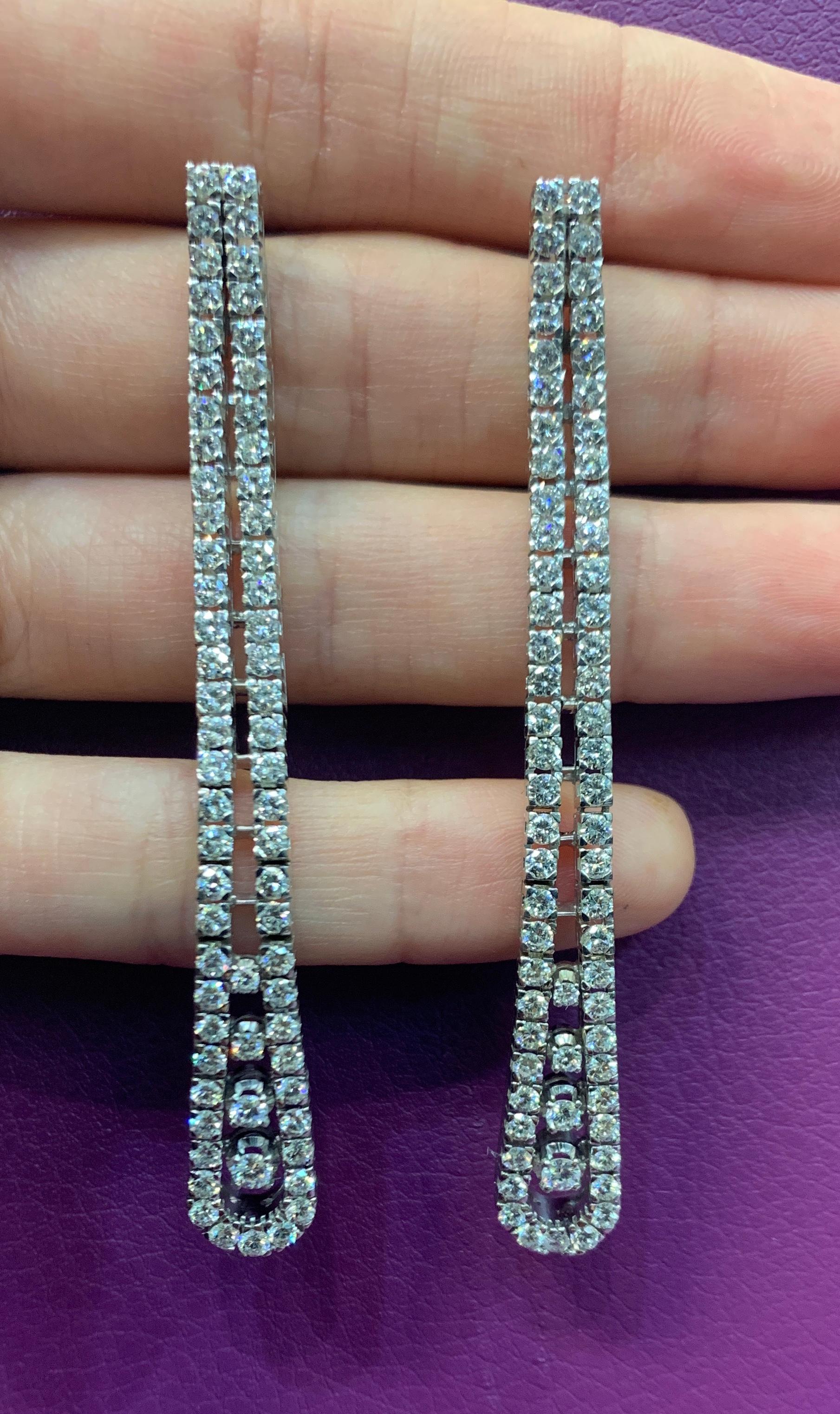 Two Row Diamond Dangle Earrings
134 brilliant cut diamonds set in 18K white gold 
Diamond Weight: Approximately 6.55 Cts  
Measurements: 2.75