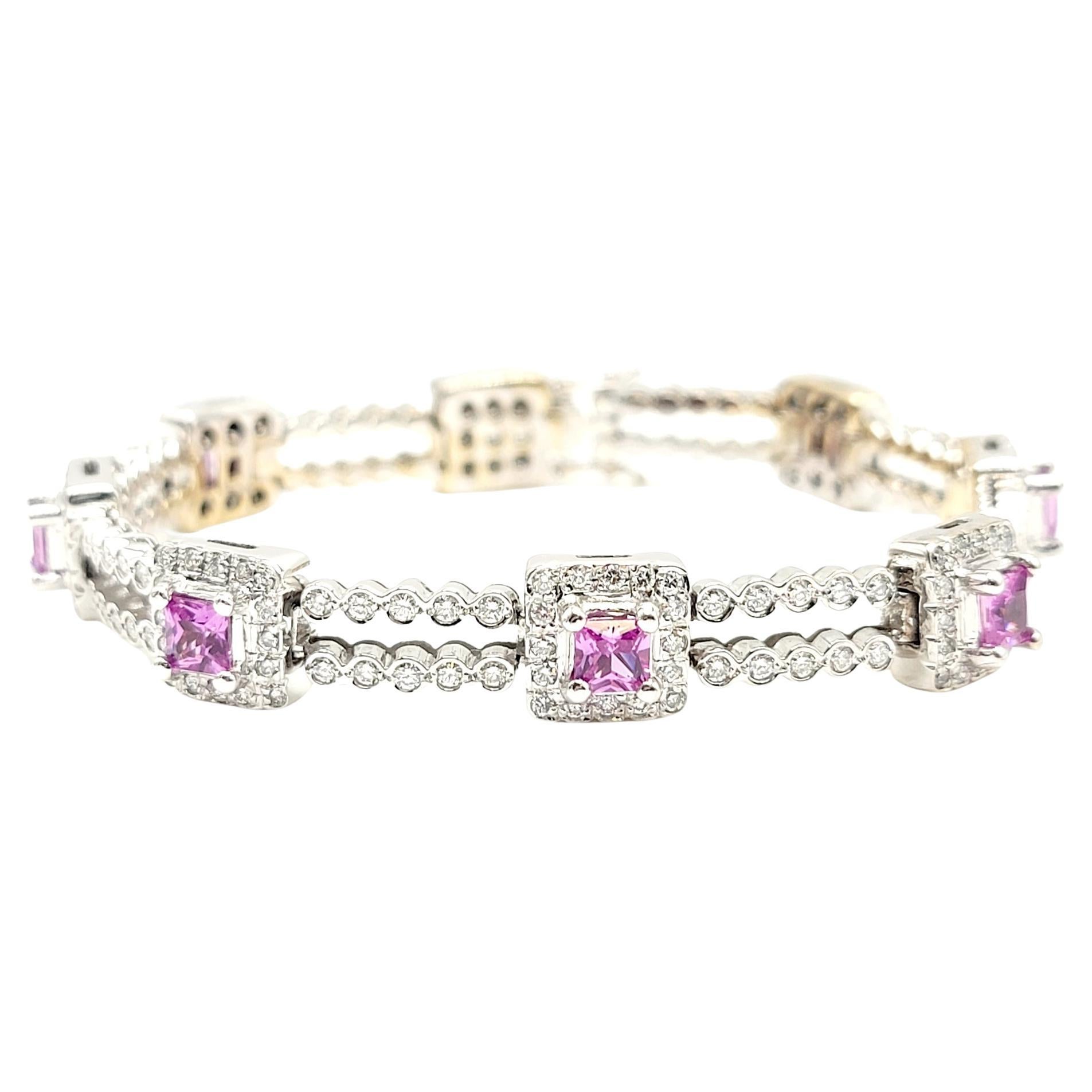 This stunning 5.72 carats total diamond and sapphire station bracelet will sparkle on your wrist and add that bright pink pop of color you've been looking for. 

Two rows of bezel set round brilliant cut diamonds link eight princess cut natural pink