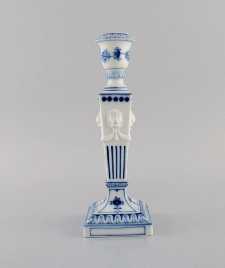 Two Royal Copenhagen Blue Fluted Plain candlesticks with lion heads. 
Dated 1969-1974. Model number 1/15.
Measures: 23 x 8 cm.
In excellent condition.
Stamped.
1st factory quality.