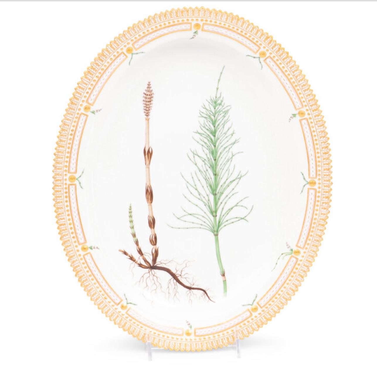 Two Royal Copenhagen Flora Danica Porcelain Serving Platters
20th Century.  Priced per platter.

the first, model 20/3518, decorated with Potamogeton Natans L.; the second, model 20/3517, decorated with Equisteum arvense L. 
Length of first 15 3/4