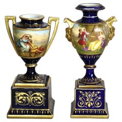Two Royal Vienna Hand Painted & Gilt Porcelain Urns with Genre Scenes C1890