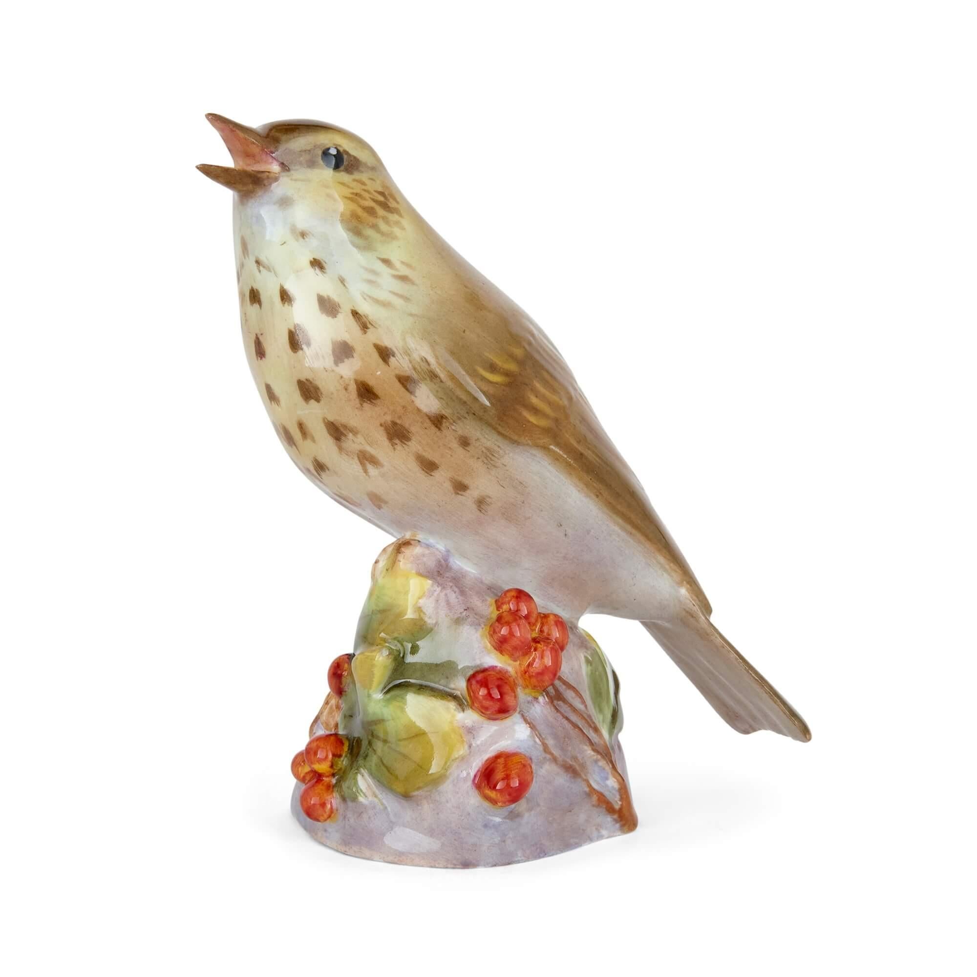 Two Royal Worcester porcelain bird models of a kingfisher and a thrush
English, c.1950
Thrush: Height 12cm, width 11cm, depth 6cm
Kingfisher: Height 8cm, width 11cm, depth 7.5cm

Made by the renowned Royal Worcester porcelain manufactory in around