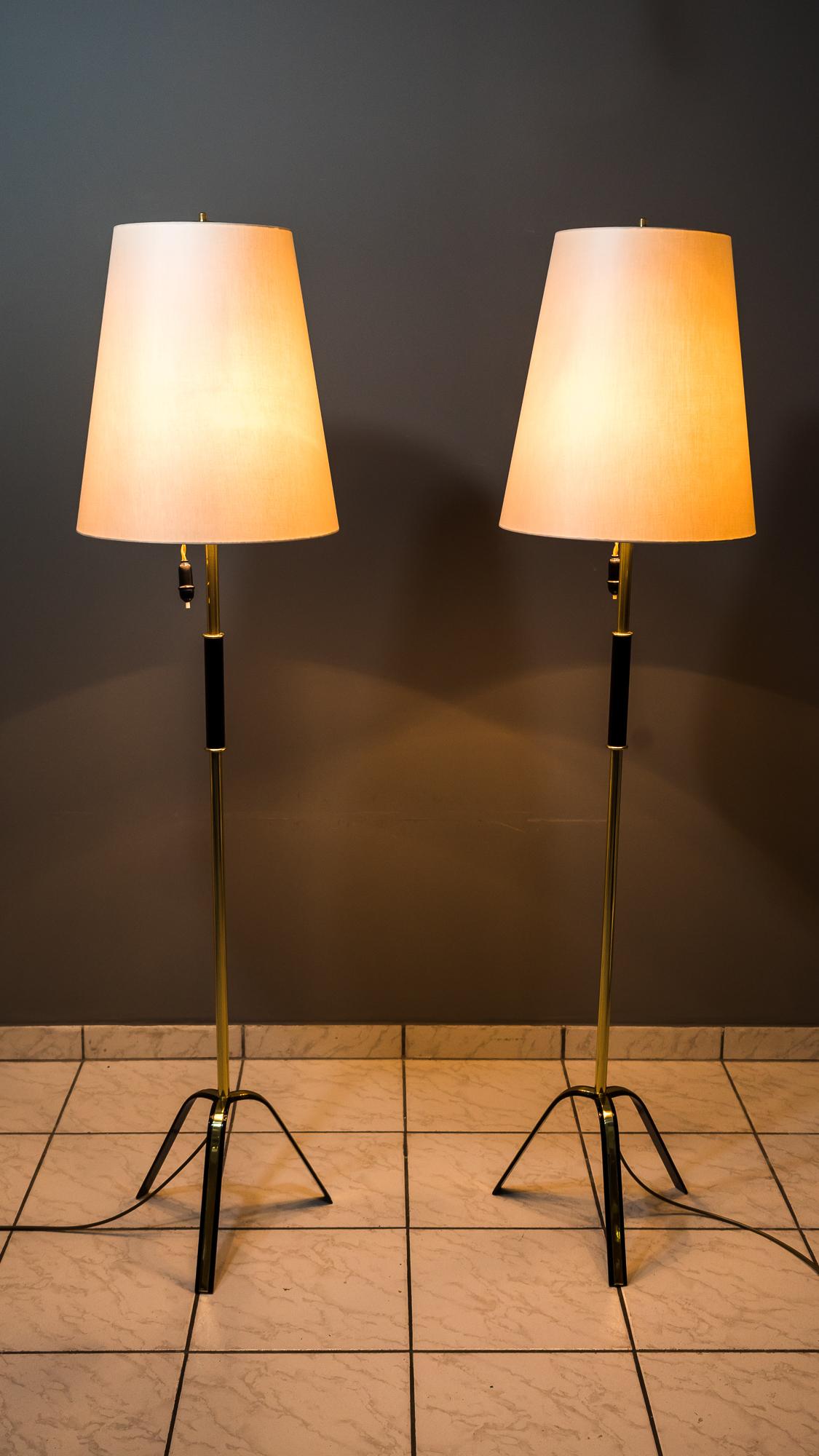 Two Rupert Nikoll floor lamps, Vienna, circa 1960s
Iron black lacquered
Brass polished and lacquered
The shades are replaced (new).