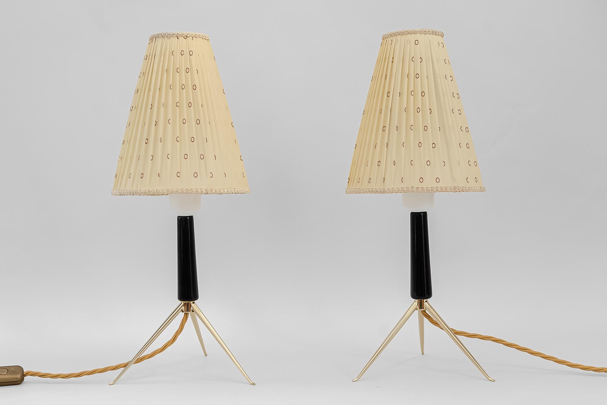 Two Rupert Nikoll table lamps, Vienna, circa 1950s
Polished and stove enamelled
Wood polished 
The shades are original old.