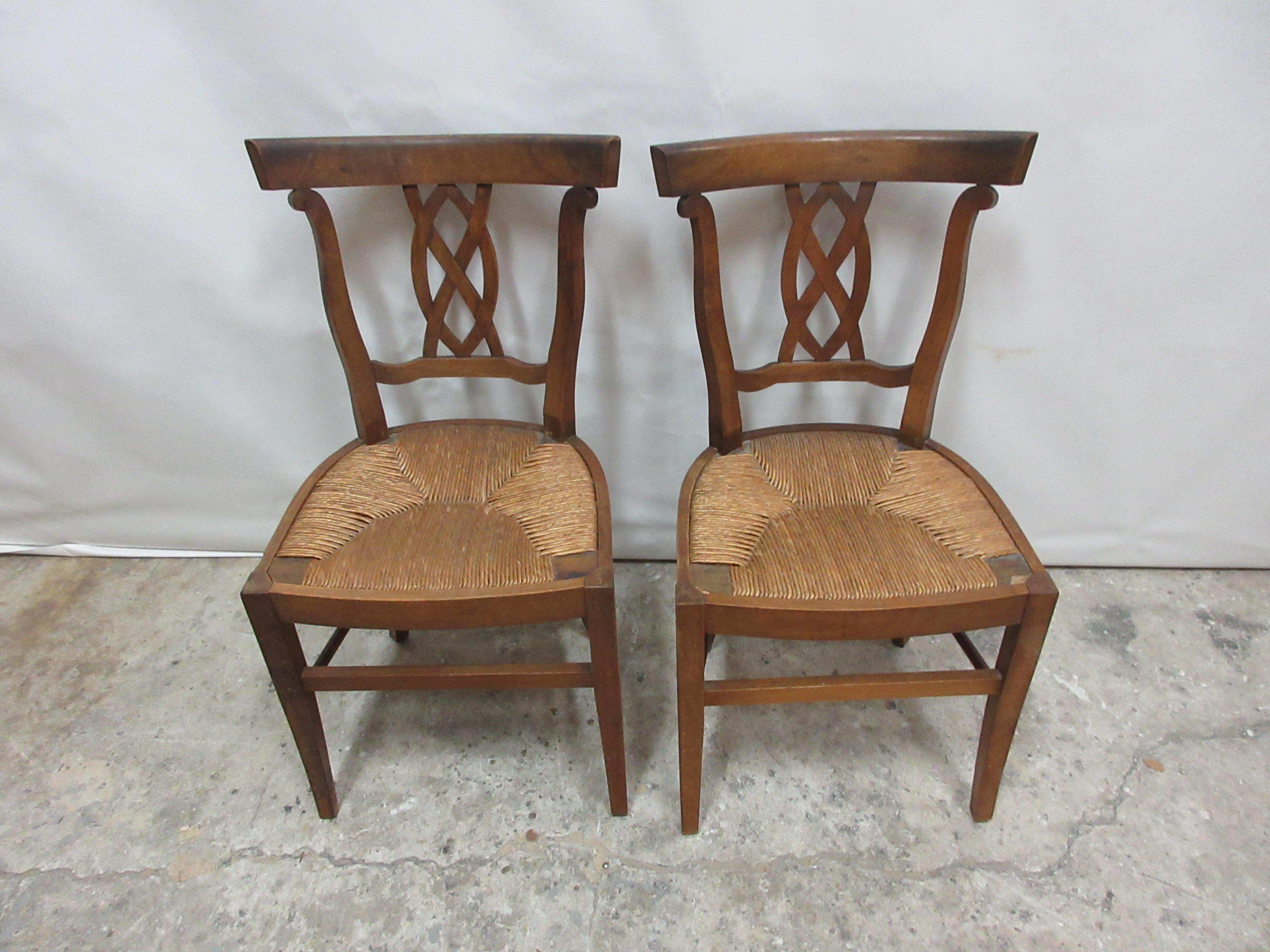 This is a set of two rush woven seat side chairs. They are in there original condition.