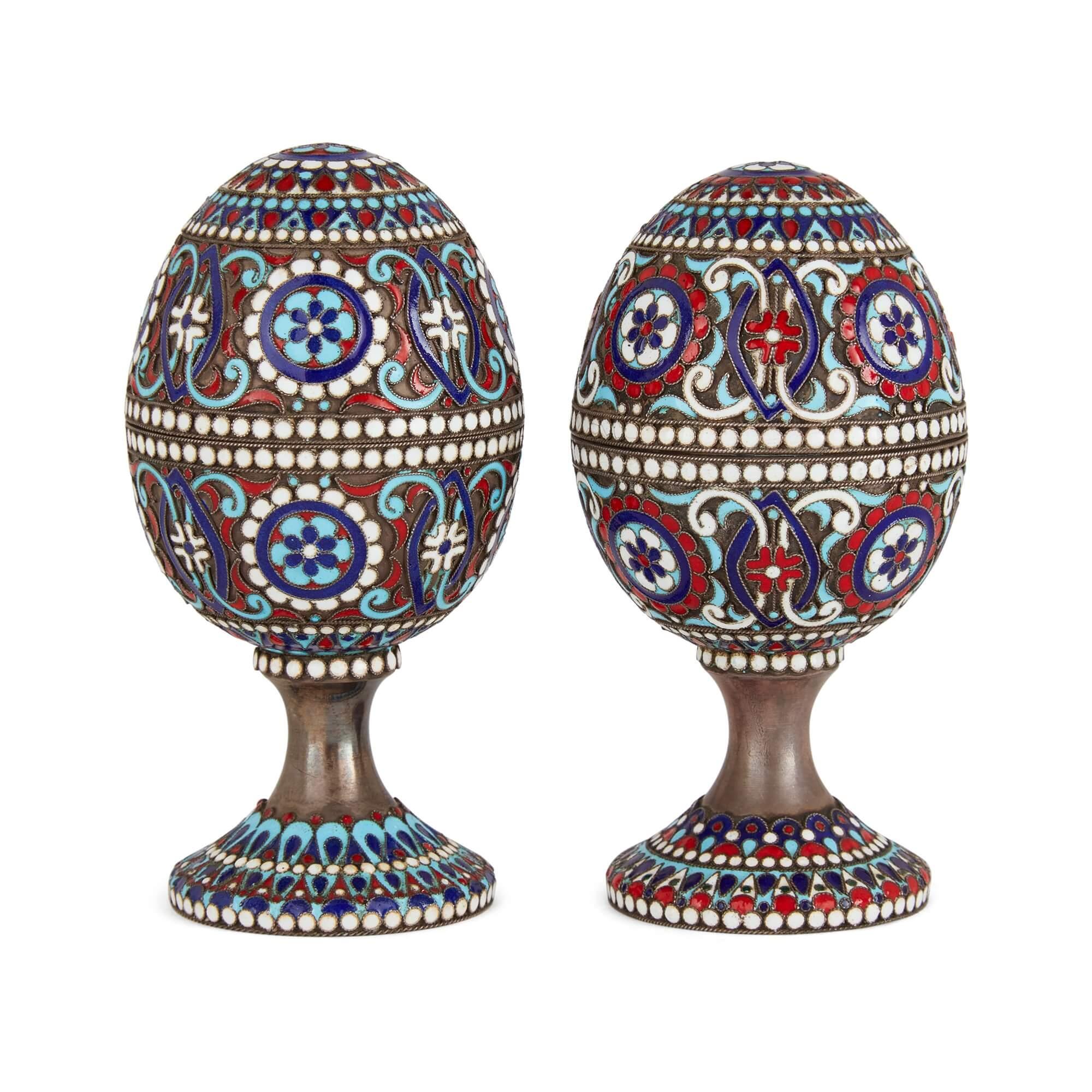 Two Russian silver gilt and cloisonné enamel Easter eggs on stands  
Russian, 20th Century  
Height 9.5cm, diameter 5cm 

The two silver gilt and cloisonné enamel eggs showcase Russia’s long tradition of crafting richly decorated Easter eggs. 