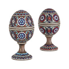 Two Russian Silver Gilt and Cloisonné Enamel Easter Eggs on Stands