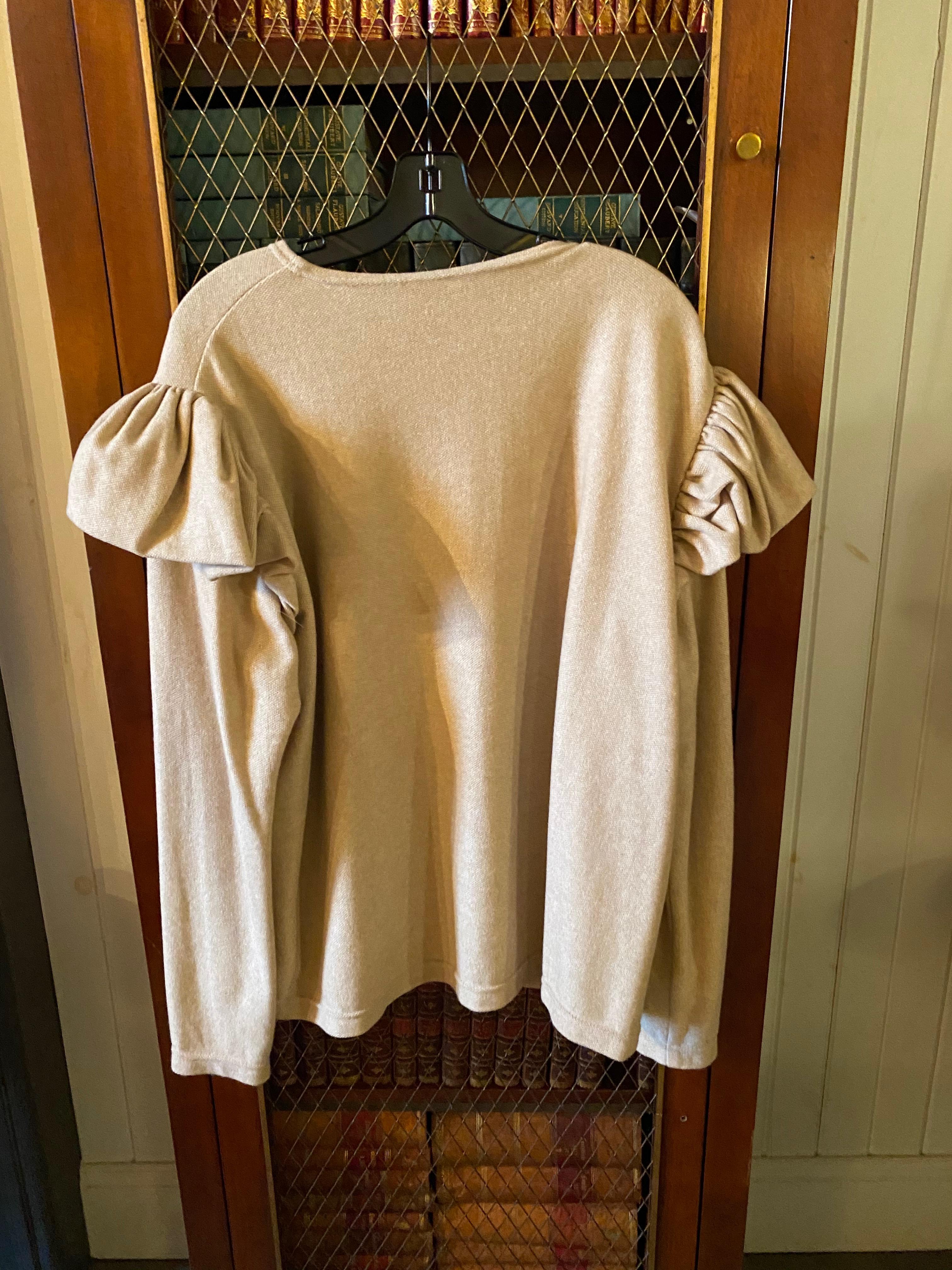 TWO SAM KORI GEORGE CASHMERE SWEATERS.

Comprising of a black and cream sweater with shoulder detail

Nice weight, 4-5 ply and of highest quality.  Priced per sweater.

Approximately size 14-16