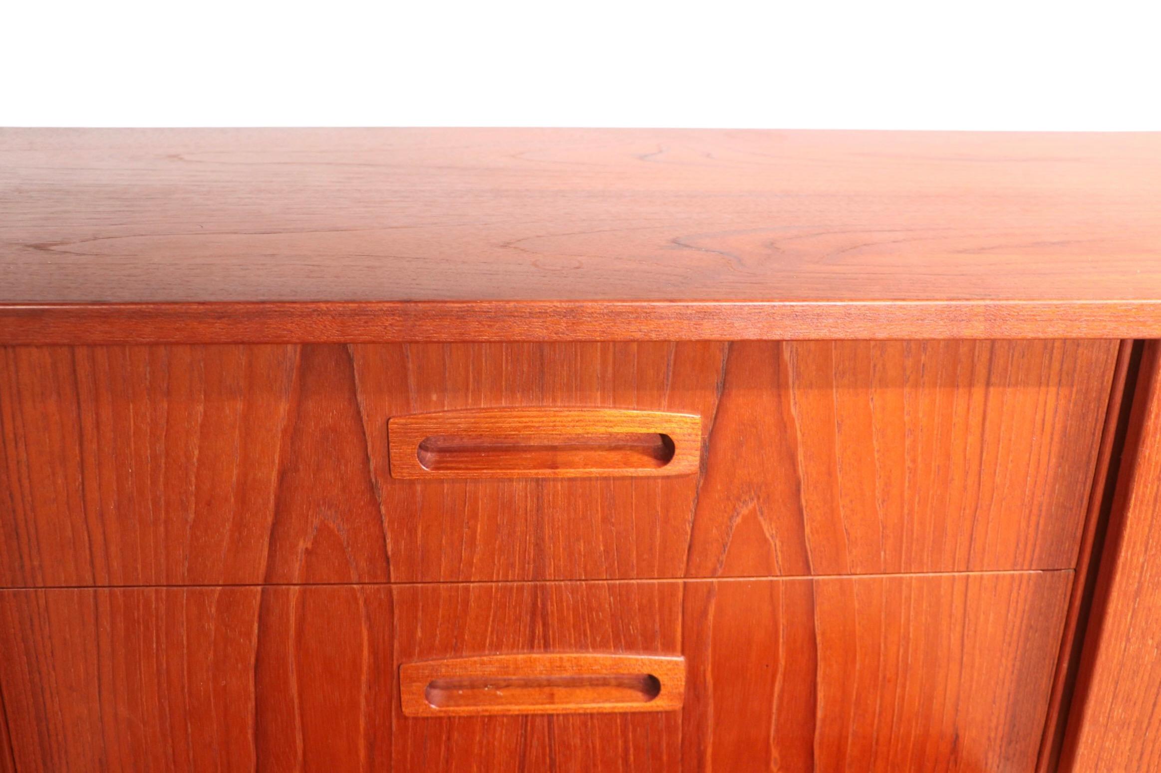 Spectacular Danish Mid Century Modern two tier sideboard, credenza executed in solid teak, in the style of Hans Wegner and other Danish and Swedish designers of the period. This example is in very fine original condition, clean and ready to use. 
