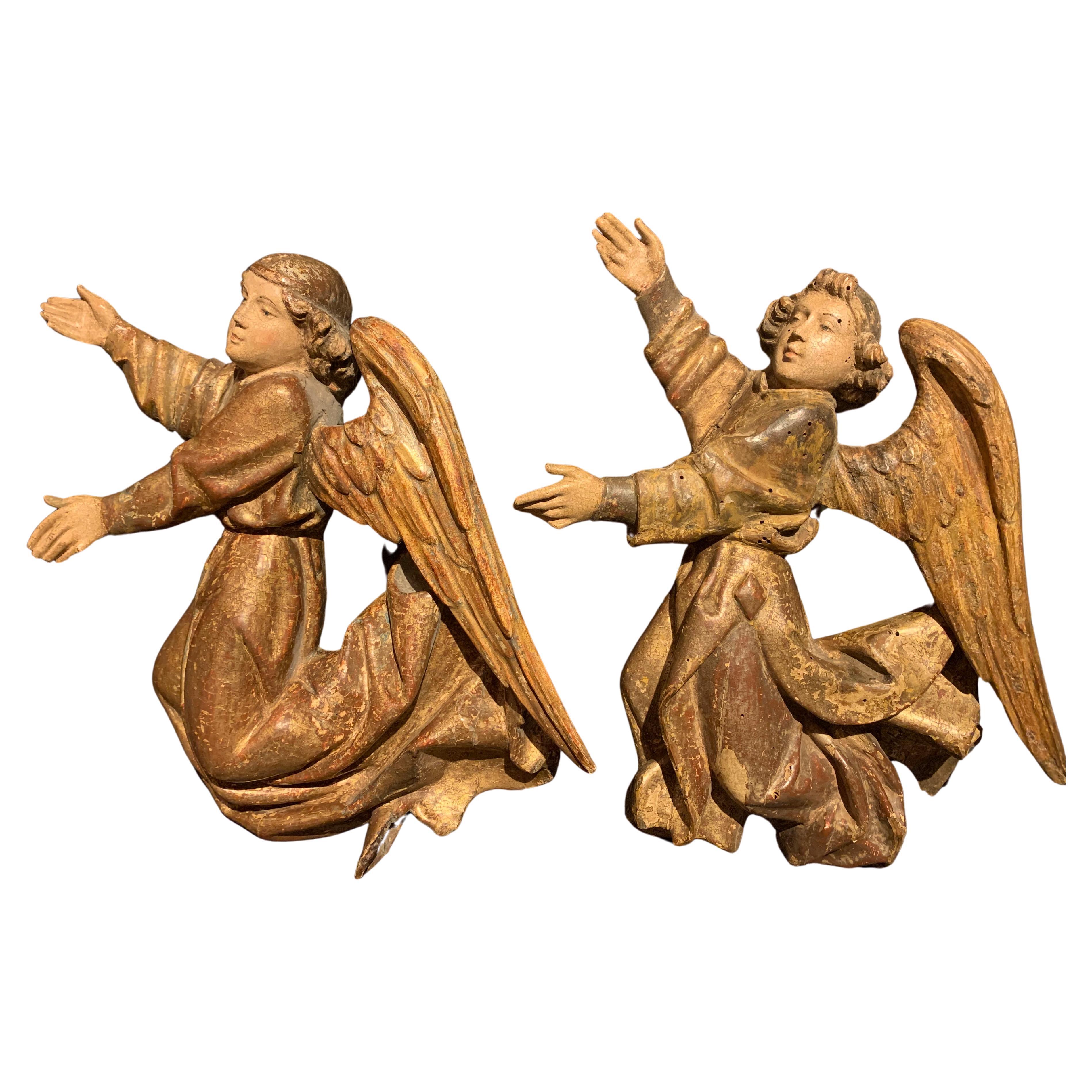 Two  Sculpted Wooden Angels , Flanders, Early 16th century.