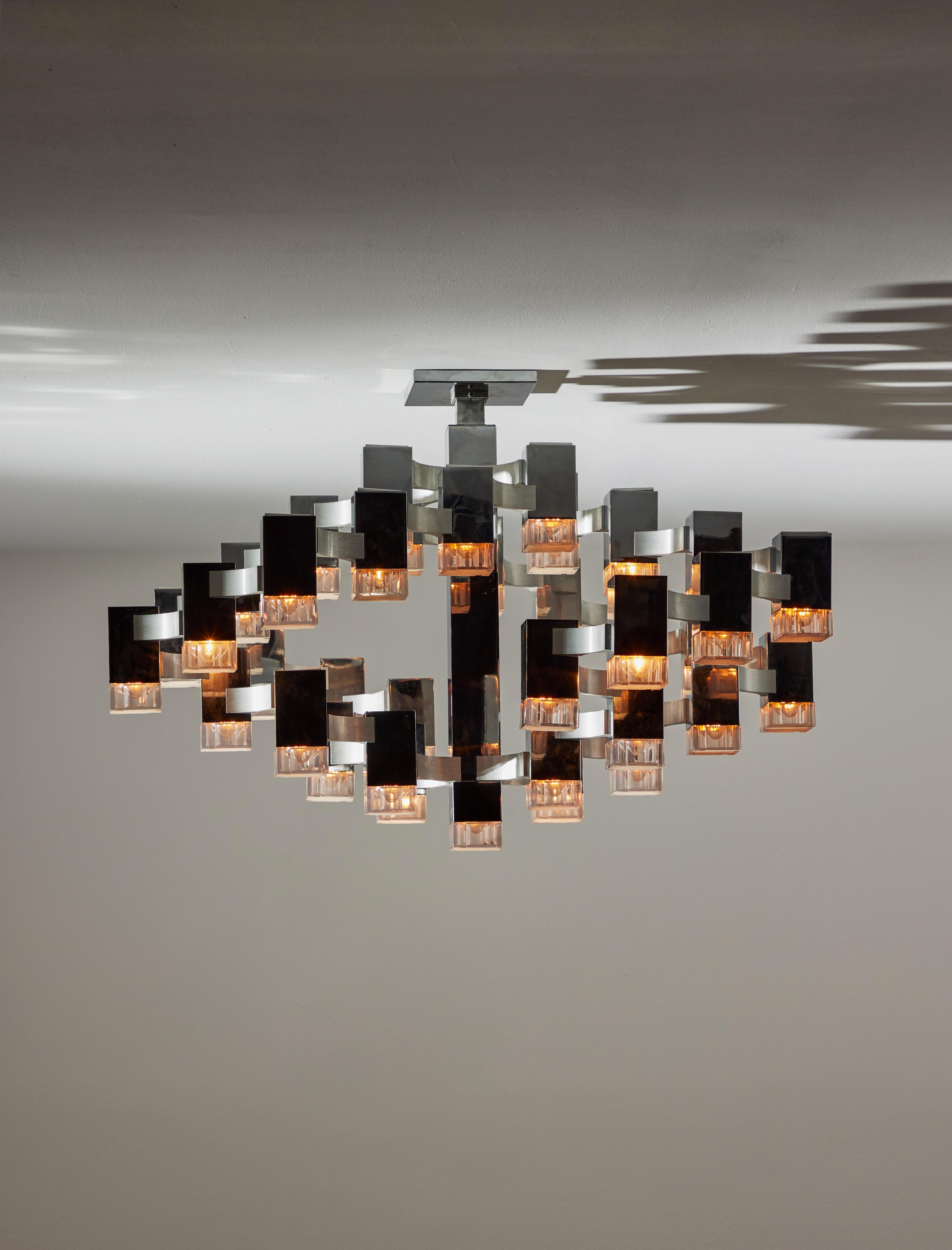 Large Sculptural flush mount ceiling light by Gaetano Sciolari. Designed and manufactured in Italy, circa the 1970s. Chrome, brushed aluminum, acrylic. Wired for U.S. standards. We recommend 36 E14 10w maximum bulbs per fixture. Bulbs are provided