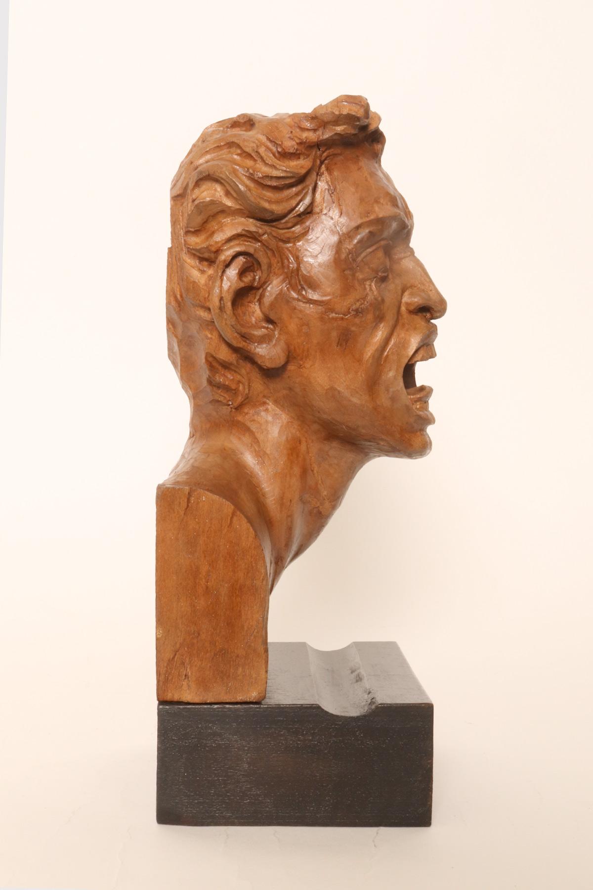 Wood Two sculptures depicting the head of Medusa and the head of a man, Italy 1900. For Sale