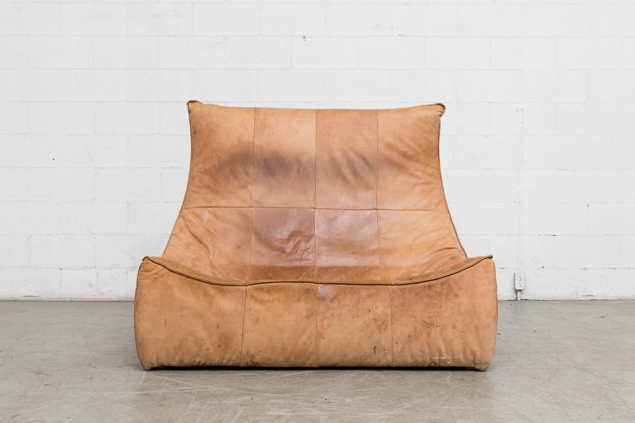 Two-seat natural leather sofa designed by Gerard van den Berg for Montis, 1970. Amazing piece of furniture design! In original condition, great patina, visible wear to leather, some staining, seat seam unravelling and evidence of cat claws to seat