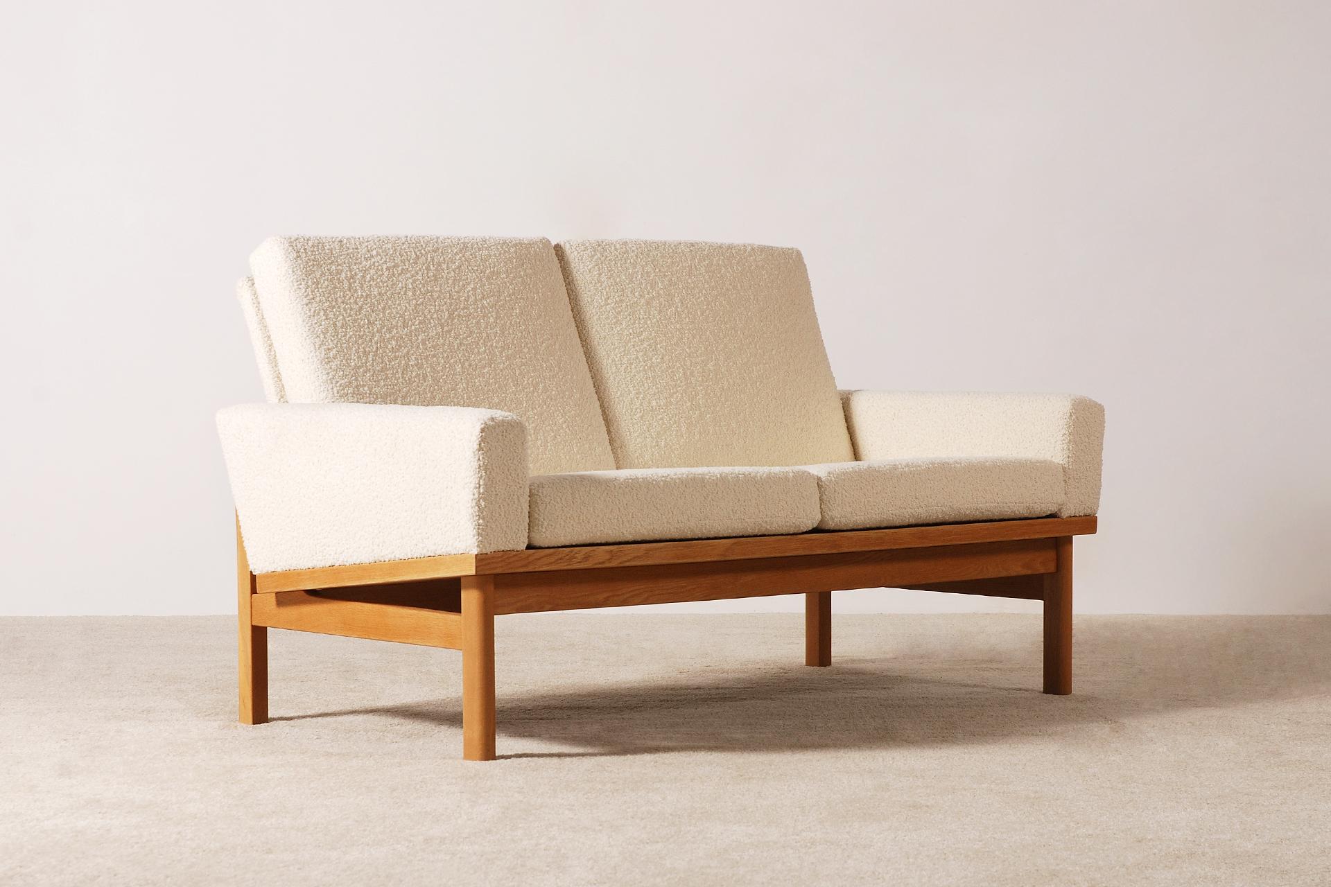 Nice oak frame and Bouclé fabric sofa by the Danish designer Poul Volther,
Denmark, circa 1960s.

This sofa have been fully restored and newly upholstered with a high quality wool 