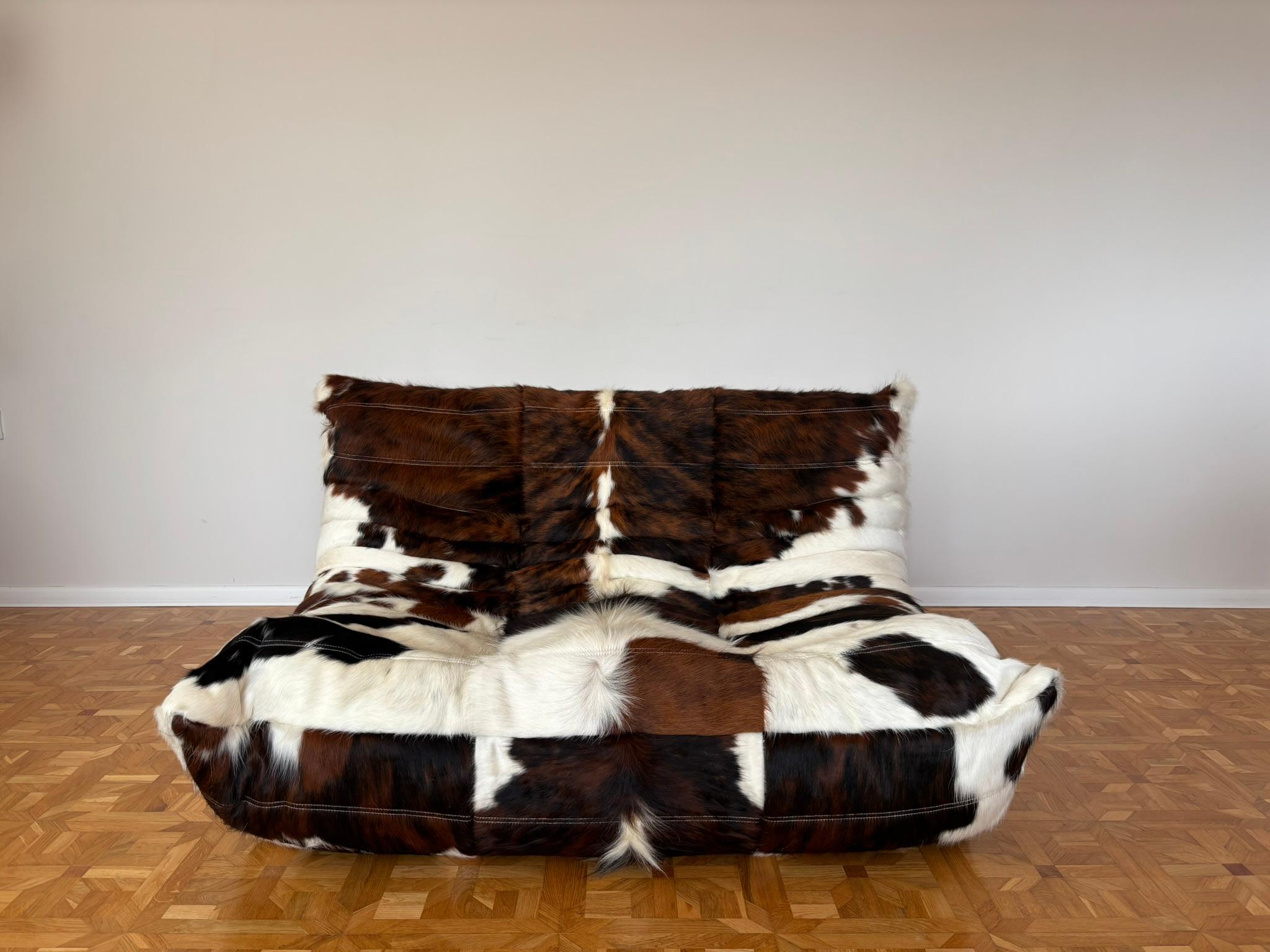 The Togo was designed by Michel Ducaroy in 1973 for Ligne Roset. It is the first sofa/chair ever made only of foam and leather. The collection features an ergonomic design with polyether foam construction and padded covers, making each piece both
