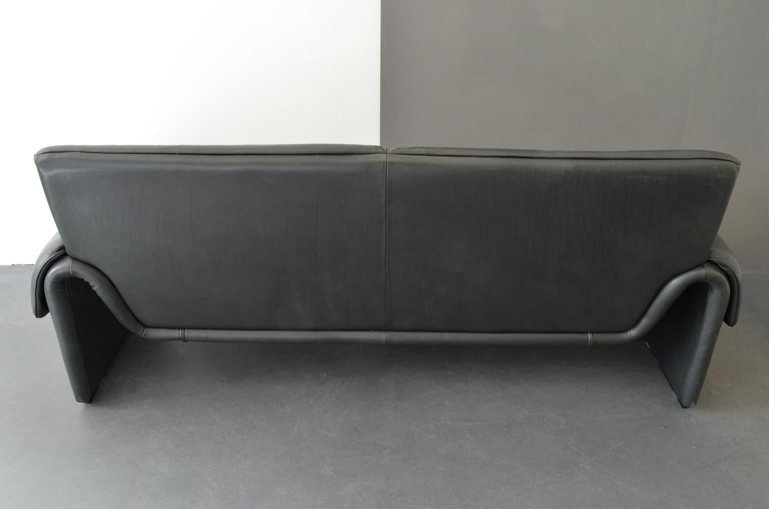 Two-seat sofa “DS-2011/12” by De Sede Factory Design, Switzerland, 1960s.
Upholstered with black leather.