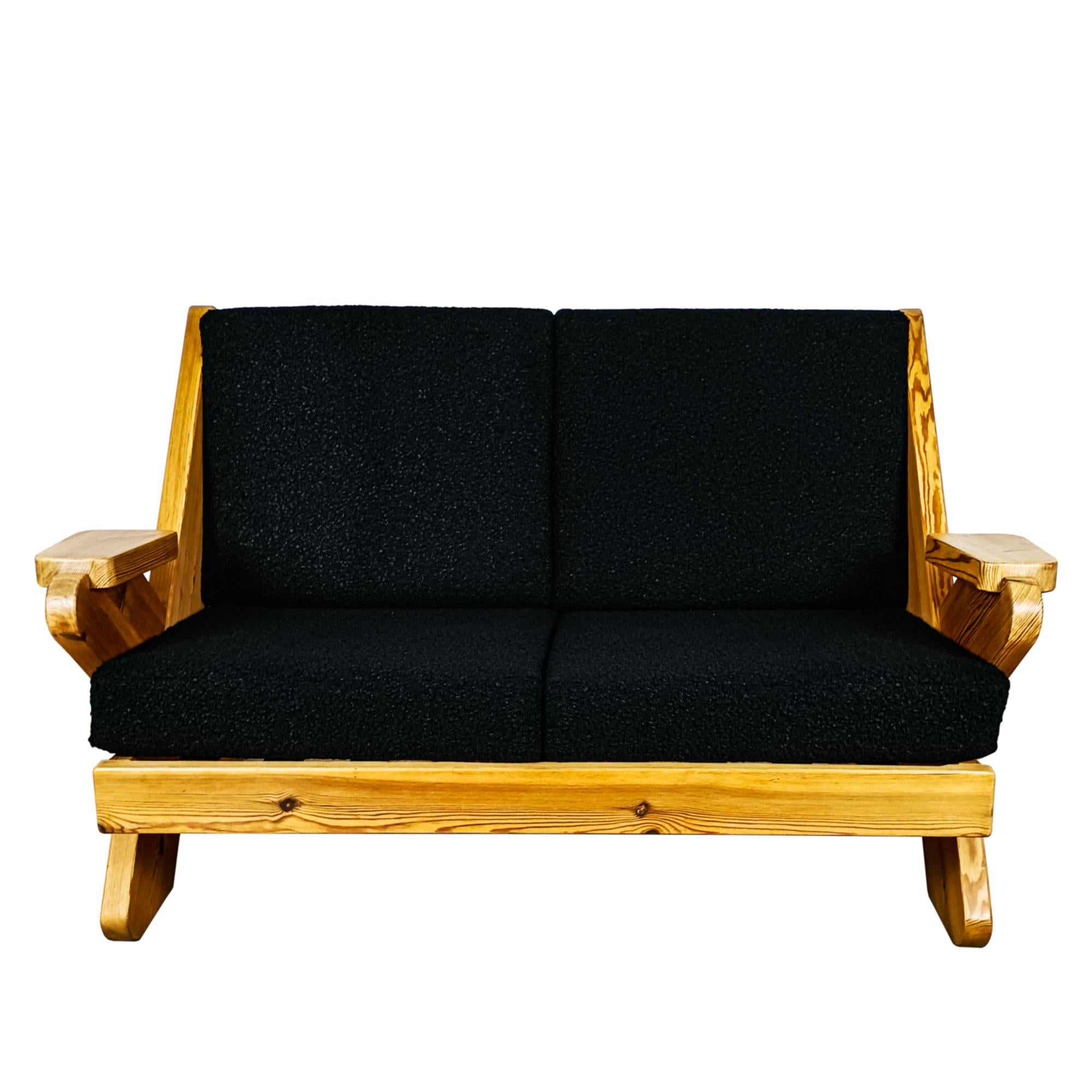 Zweisitzer-Sofa aus entlacktem und gewachstem massivem Kiefernholz, Rückenlehne aus originalem Segeltuch, Kissen aus neuer 'Astrakhan'-Wolle.

Spanien um 1970