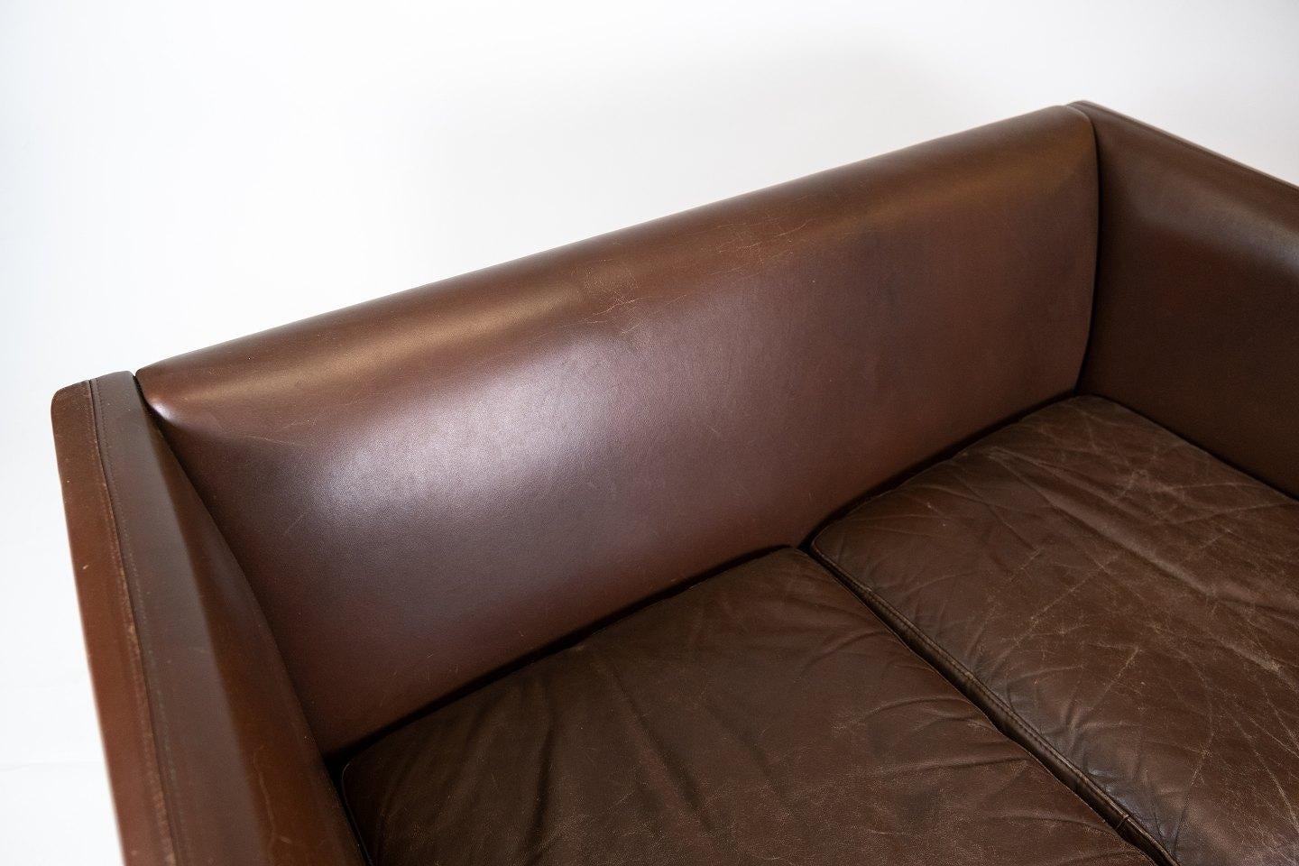 Scandinavian Modern Two Seater Sofa Upholstered with Dark Brown Leather of Danish Design, 1960s For Sale