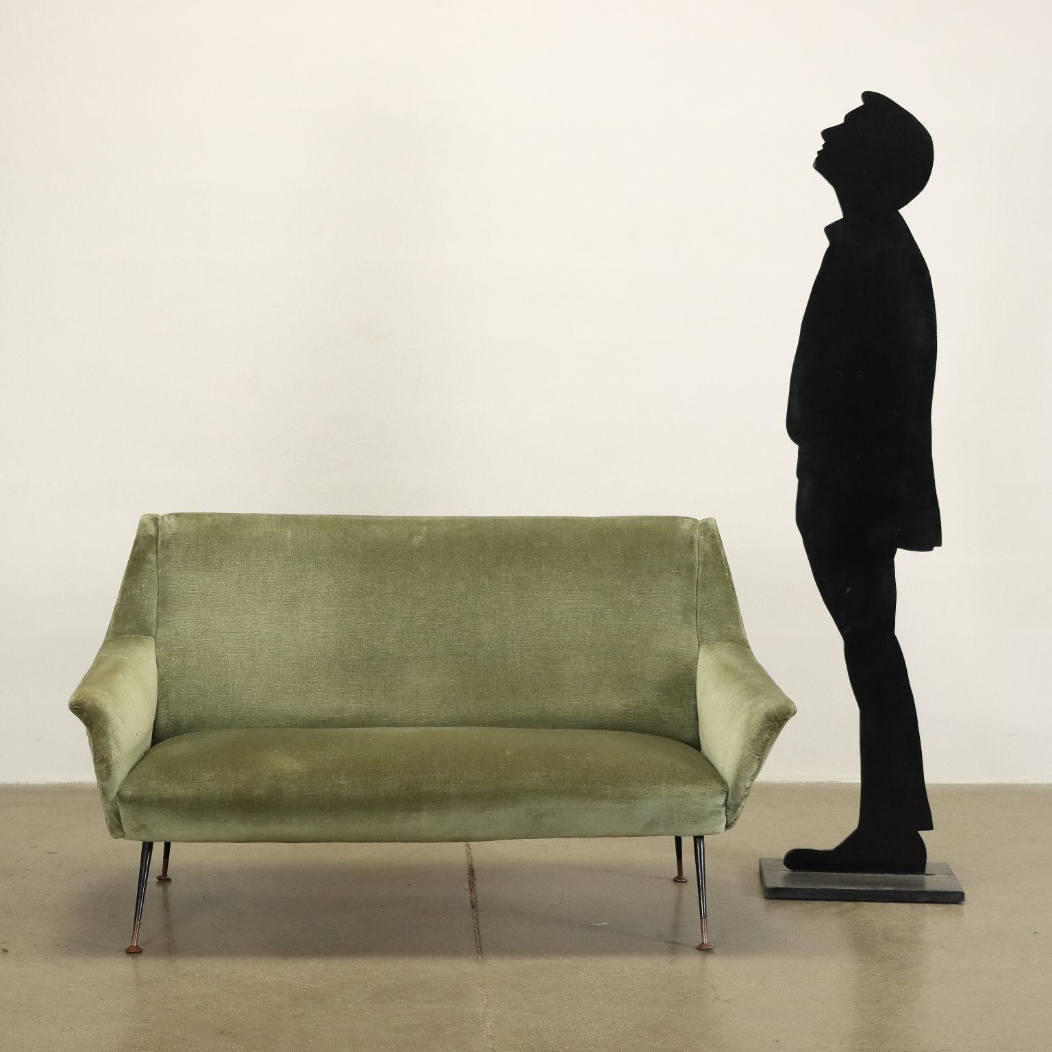 Nice 50s-60s two-seater sofa of Italian manufacture with foam padding and original green velvet upholstery, metal legs.